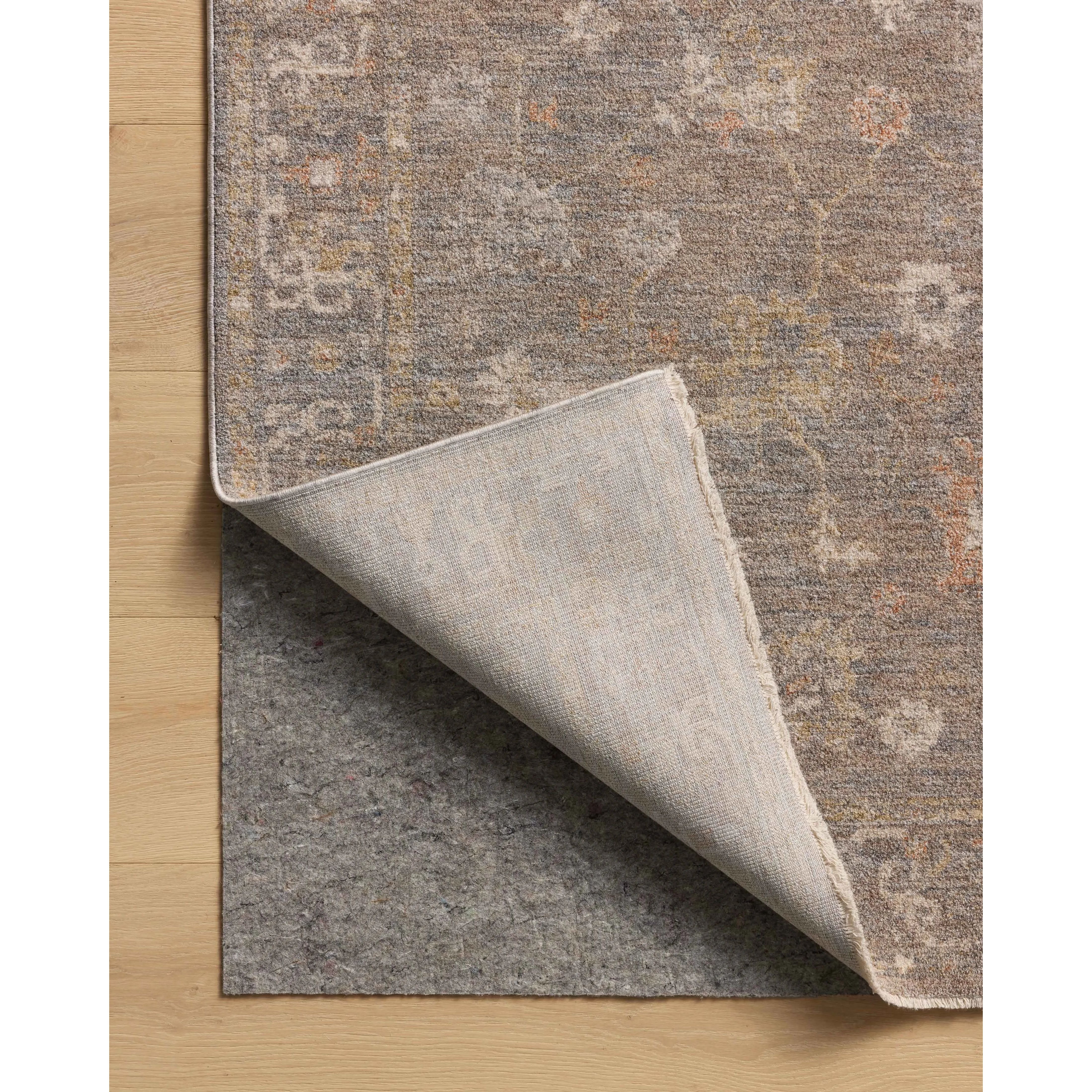 The Louisa Collection is a serene area rug based on beautiful, traditional Turkish designs updated in calm colorways by Chris Loves Julia in collaboration with Loloi. Pale blues, creams, and browns create a sense of softness, but so does the rugs pile, which is made of easy-to-clean, velvety polyester. Amethyst Home provides interior design, new home construction design consulting, vintage area rugs, and lighting in the Dallas metro area.