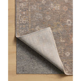 The Louisa Collection is a serene area rug based on beautiful, traditional Turkish designs updated in calm colorways by Chris Loves Julia in collaboration with Loloi. Pale blues, creams, and browns create a sense of softness, but so does the rugs pile, which is made of easy-to-clean, velvety polyester. Amethyst Home provides interior design, new home construction design consulting, vintage area rugs, and lighting in the Kansas City metro area.