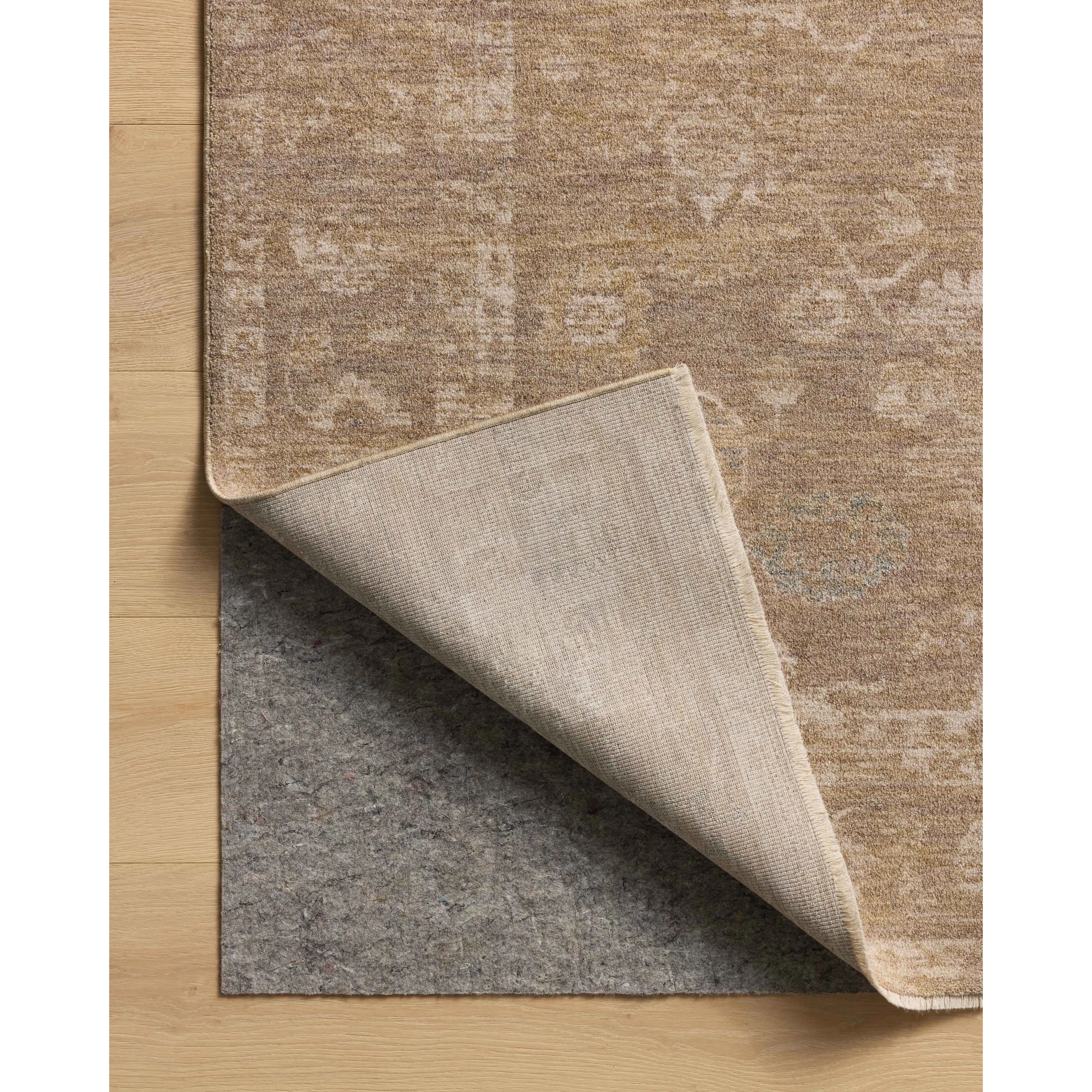 The Louisa Collection is a serene area rug based on beautiful, traditional Turkish designs updated in calm colorways by Chris Loves Julia in collaboration with Loloi. Pale blues, creams, and browns create a sense of softness, but so does the rugs pile, which is made of easy-to-clean, velvety polyester. Amethyst Home provides interior design, new home construction design consulting, vintage area rugs, and lighting in the Boston metro area.