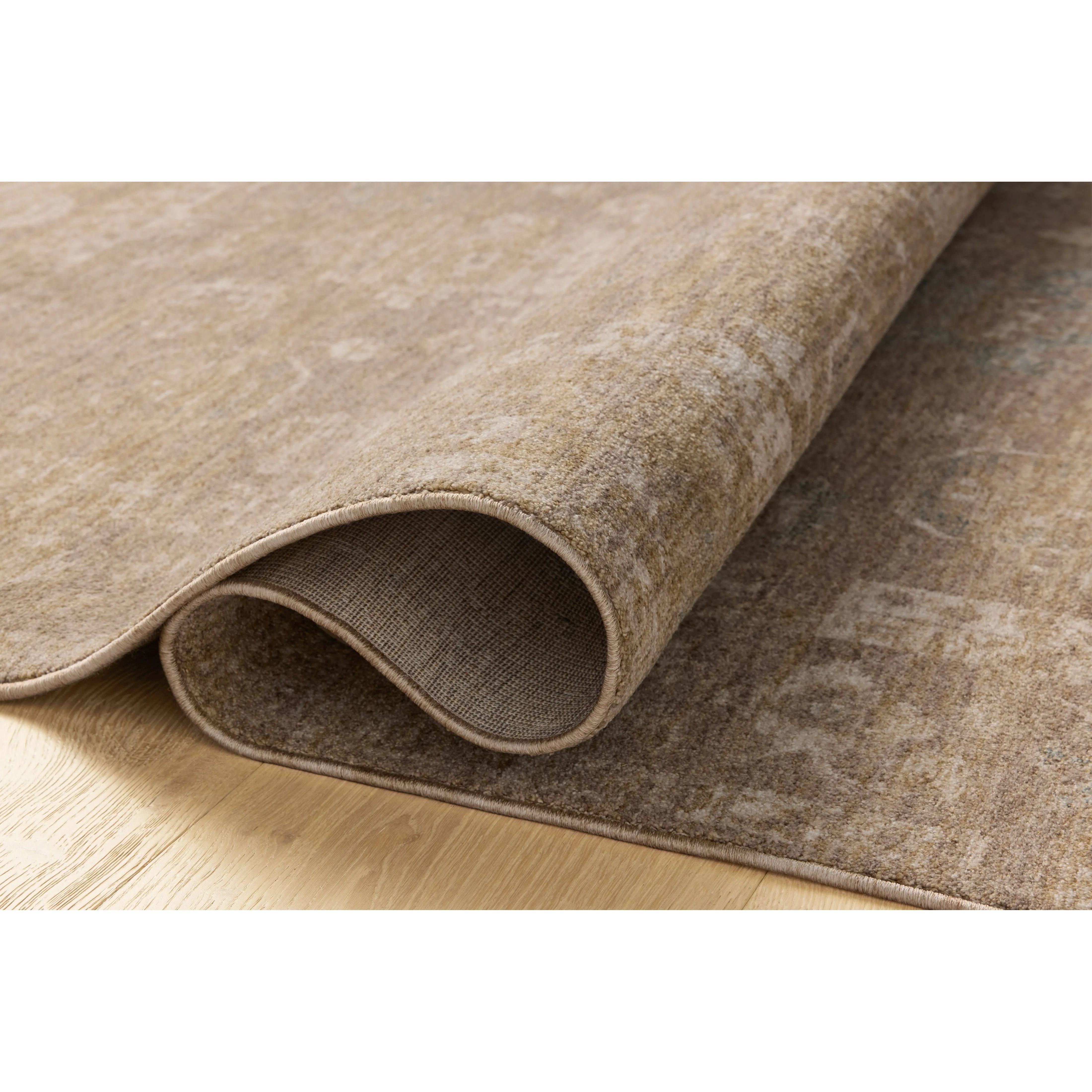 The Louisa Collection is a serene area rug based on beautiful, traditional Turkish designs updated in calm colorways by Chris Loves Julia in collaboration with Loloi. Pale blues, creams, and browns create a sense of softness, but so does the rugs pile, which is made of easy-to-clean, velvety polyester. Amethyst Home provides interior design, new home construction design consulting, vintage area rugs, and lighting in the Portland metro area.