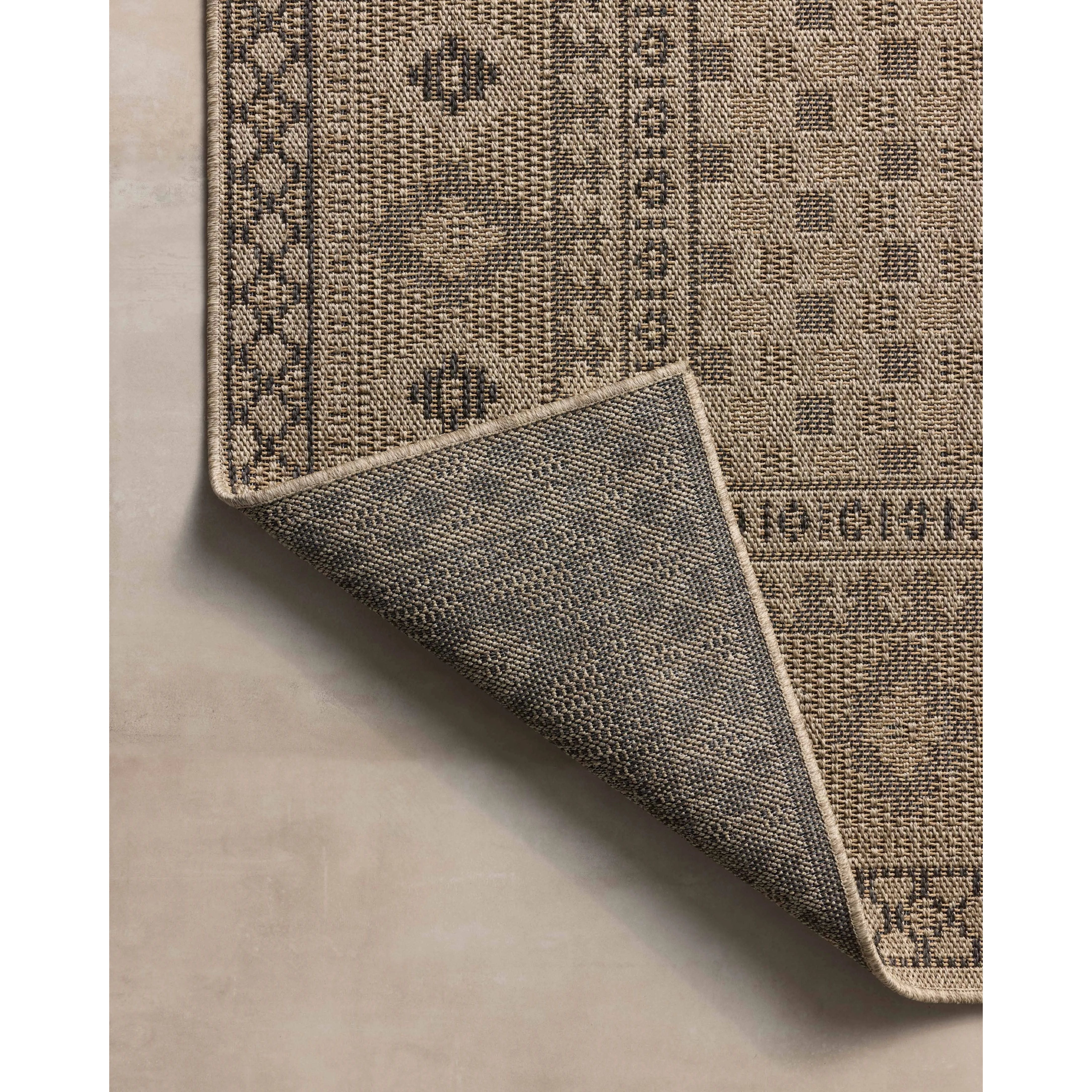 The Providence Collection is an indoor/outdoor rug with a woven-style design by Chris Loves Julia x Loloi. Providence is made of extra durable power-loomed polyester for versatile styling in patios, mudrooms, dining rooms, hallways, or more. Amethyst Home provides interior design, new home construction design consulting, vintage area rugs, and lighting in the Newport Beach metro area.