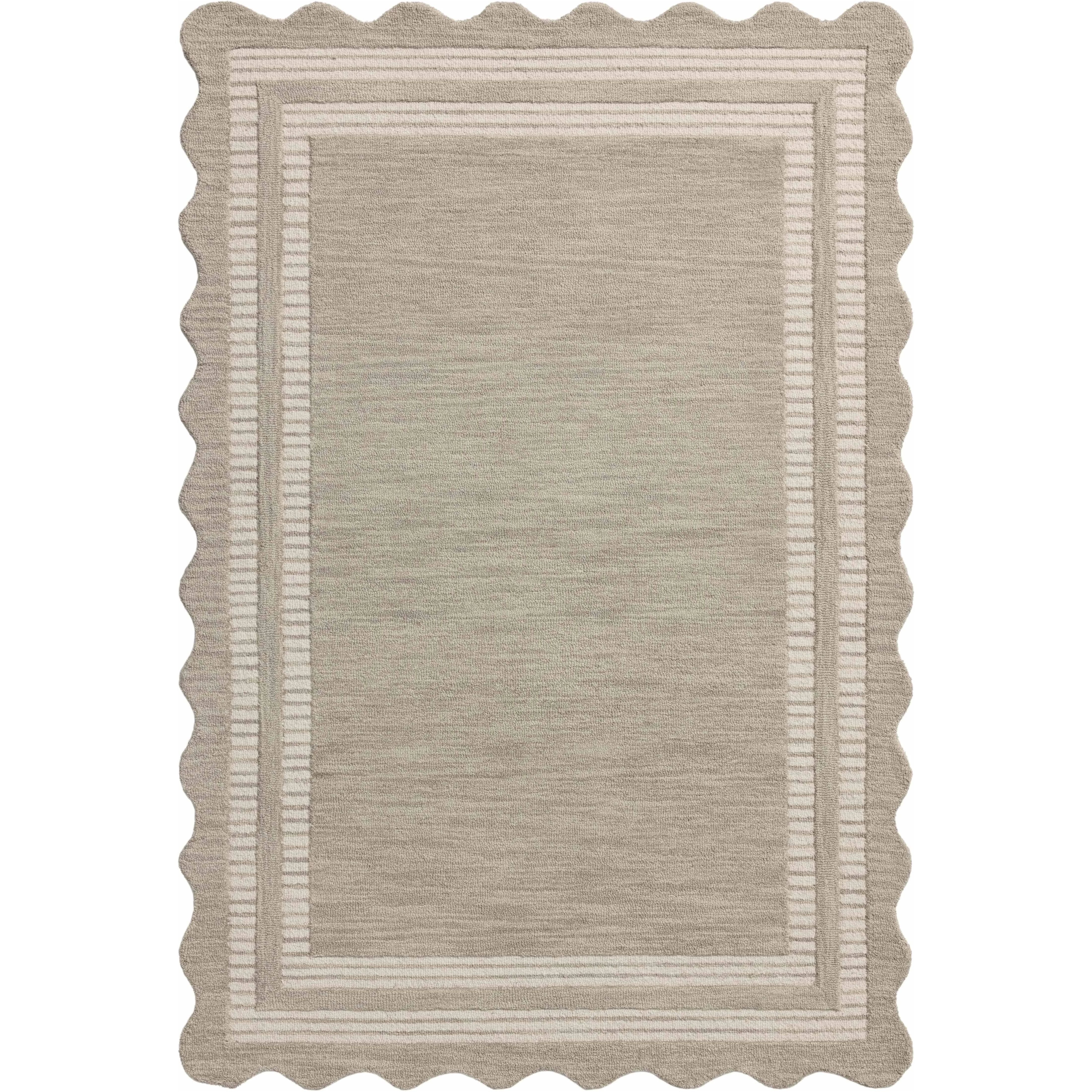 The Scottie Collection from Chris Loves Julia x Loloi is a hand-tufted wool area rug with a playful scalloped edge and lower-pile, striped border for a touch of structure. The rugs overall pile is thick and plush, available in easygoing earth tones and neutral colorways. Amethyst Home provides interior design, new home construction design consulting, vintage area rugs, and lighting in the Des Moines metro area.