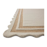 Featuring Chris Loves Julia × Loloi Scottie Ivory / Rust Rug by Loloi at Amethyst Home. The Scottie Collection from Chris Loves Julia x Loloi is a hand-tufted wool area rug with a playful scalloped edge and lower-pile, striped border for a touch of structure. The rugs overall pile is thick and plush, available in easygoing earth tones and neutral colorways. T. Amethyst Home provides interior design, new home construction design consulting, vintage area rugs, and lighting in the Houston metro area.