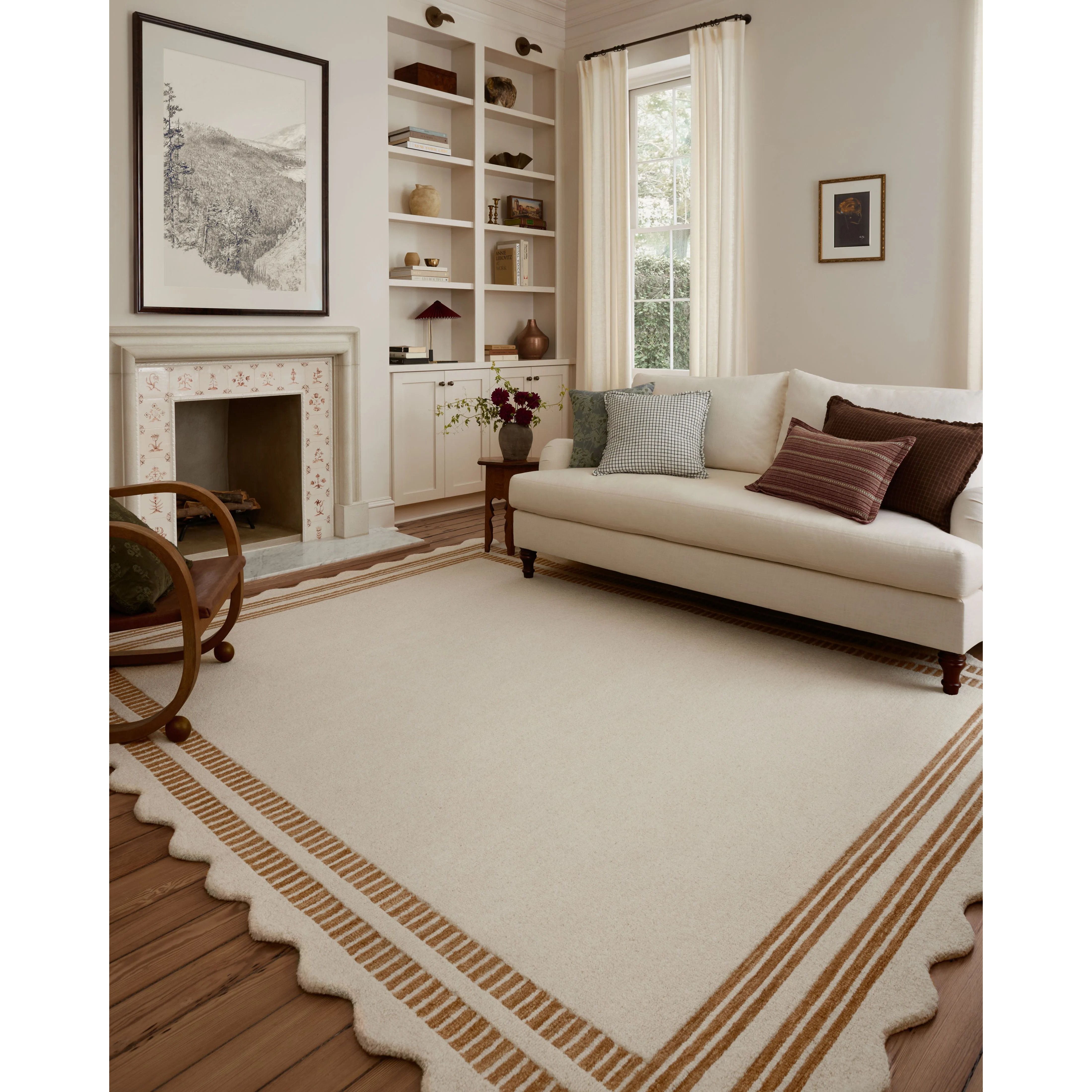 The Scottie Collection from Chris Loves Julia x Loloi is a hand-tufted wool area rug with a playful scalloped edge and lower-pile, striped border for a touch of structure. The rugs overall pile is thick and plush, available in easygoing earth tones and neutral colorways. Amethyst Home provides interior design, new home construction design consulting, vintage area rugs, and lighting in the Miami metro area.