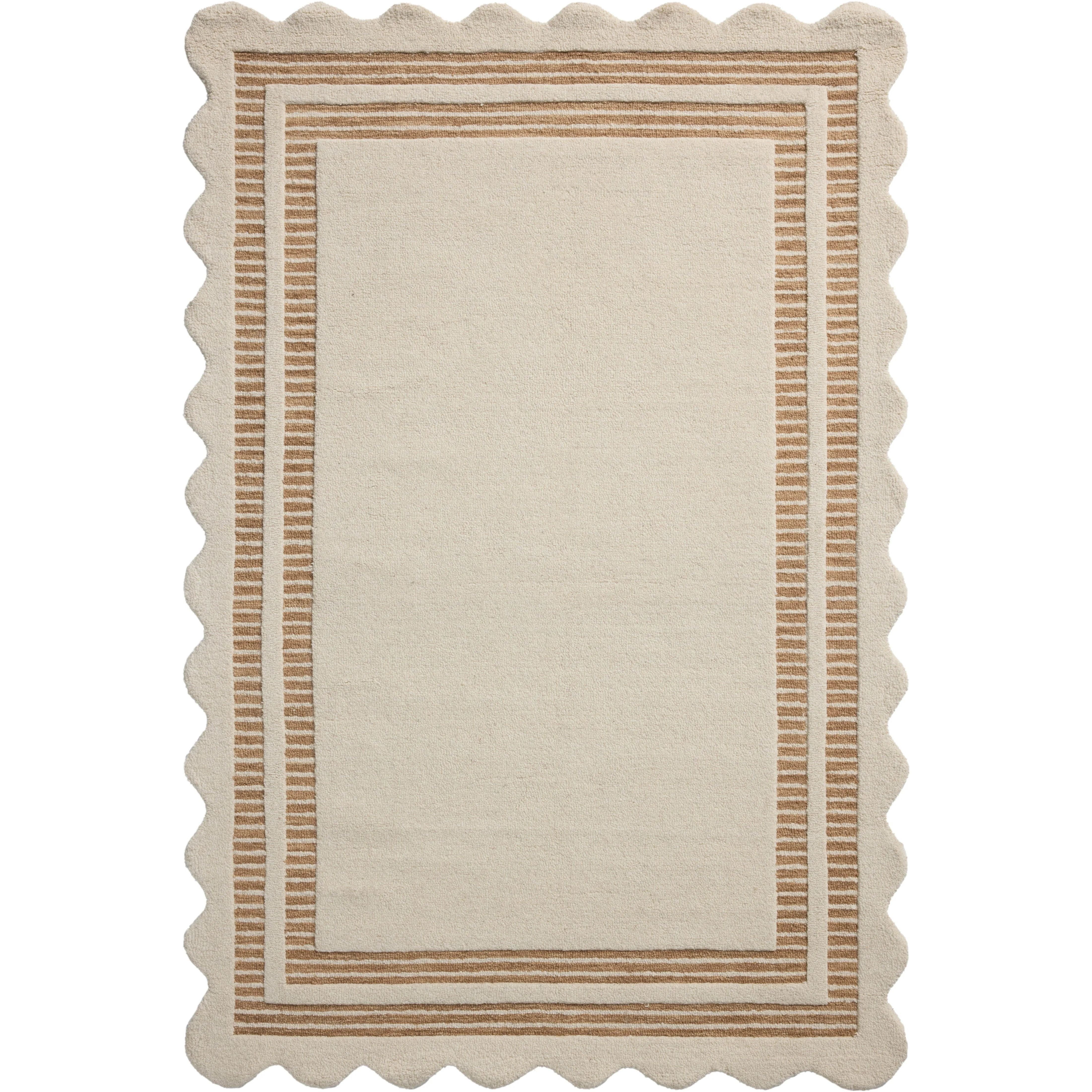 The Scottie Collection from Chris Loves Julia x Loloi is a hand-tufted wool area rug with a playful scalloped edge and lower-pile, striped border for a touch of structure. The rugs overall pile is thick and plush, available in easygoing earth tones and neutral colorways. Amethyst Home provides interior design, new home construction design consulting, vintage area rugs, and lighting in the San Diego metro area.