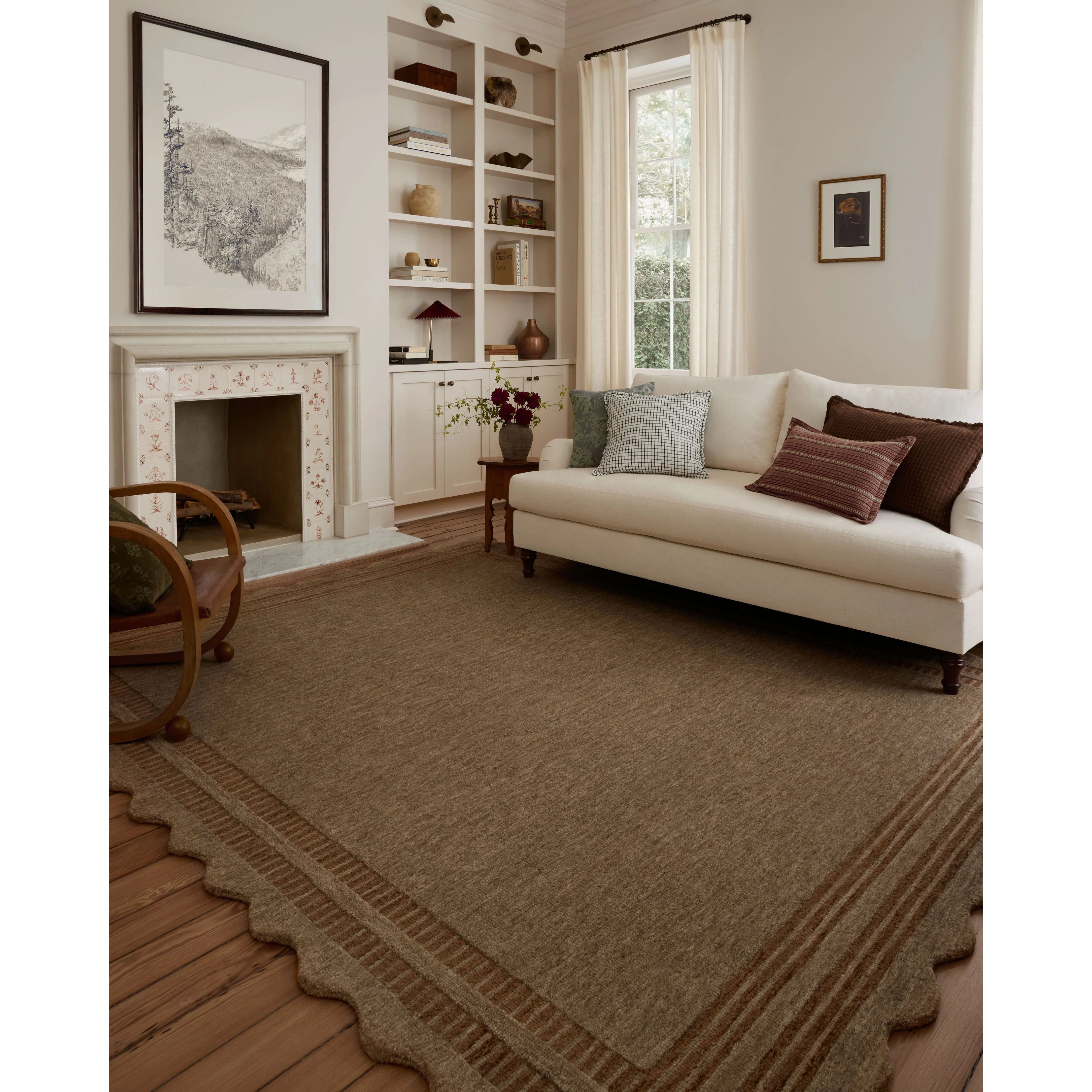 The Scottie Collection from Chris Loves Julia x Loloi is a hand-tufted wool area rug with a playful scalloped edge and lower-pile, striped border for a touch of structure. The rugs overall pile is thick and plush, available in easygoing earth tones and neutral colorways. Amethyst Home provides interior design, new home construction design consulting, vintage area rugs, and lighting in the San Diego metro area.