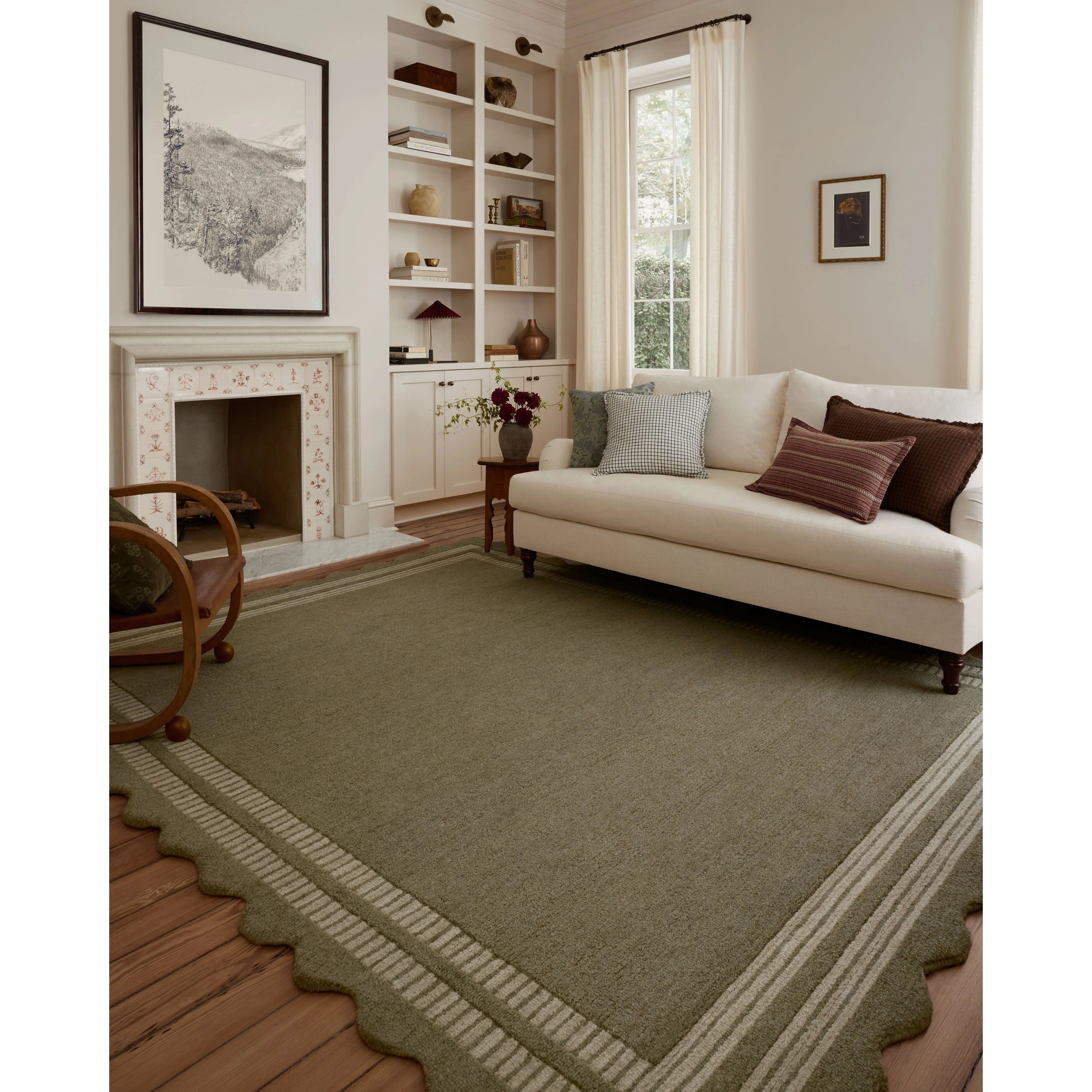The Scottie Collection from Chris Loves Julia x Loloi is a hand-tufted wool area rug with a playful scalloped edge and lower-pile, striped border for a touch of structure. The rugs overall pile is thick and plush, available in easygoing earth tones and neutral colorways. Amethyst Home provides interior design, new home construction design consulting, vintage area rugs, and lighting in the San Diego metro area.