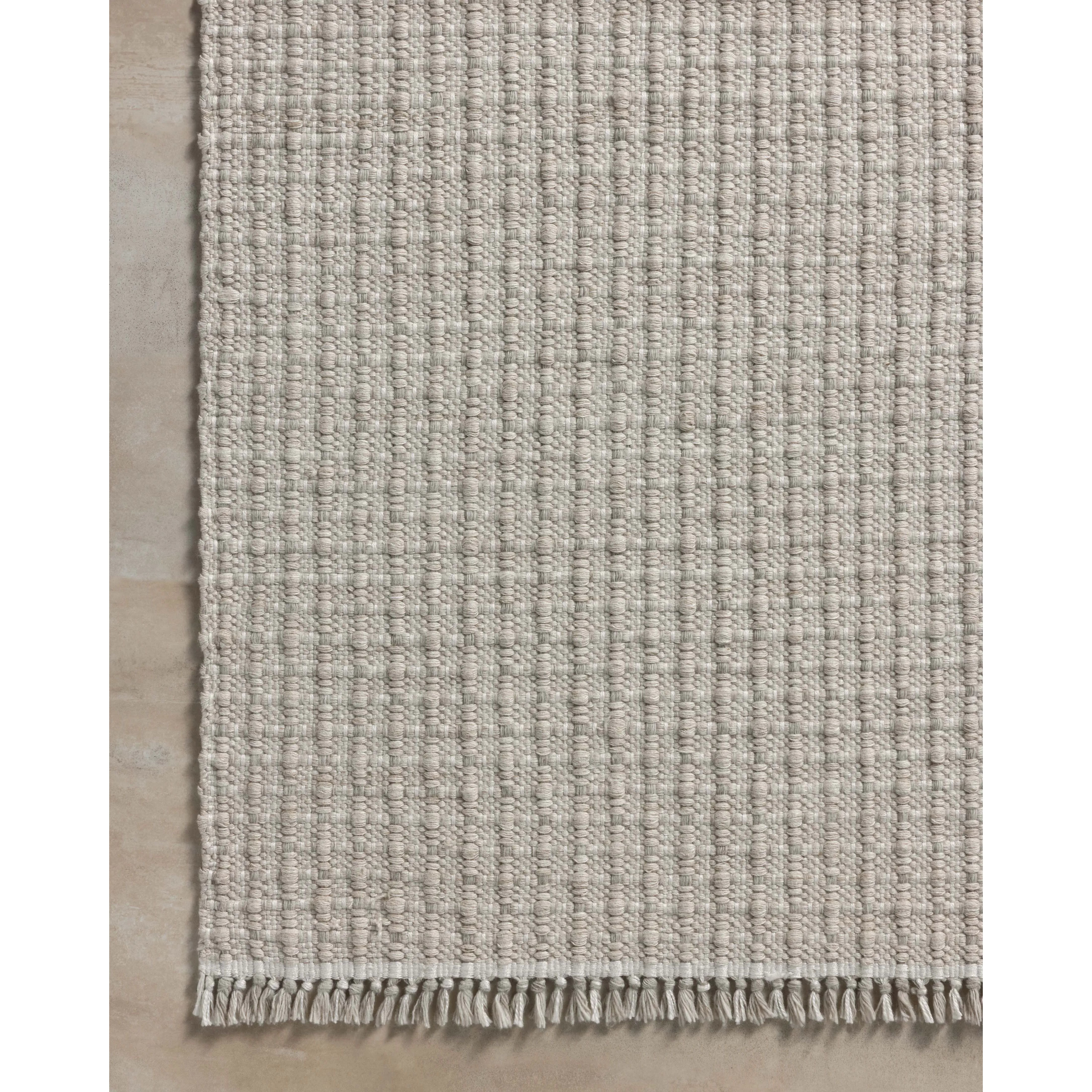The Duncan Collection is a handmade area rug thats interwoven with white threads for subtle contrast and finished with fringed edges. This collection is soft yet exceptionally durable and easy to clean, making it right at home in busy living rooms, entryways, dining rooms, and outdoor patios. Amethyst Home provides interior design, new home construction design consulting, vintage area rugs, and lighting in the Washington metro area.