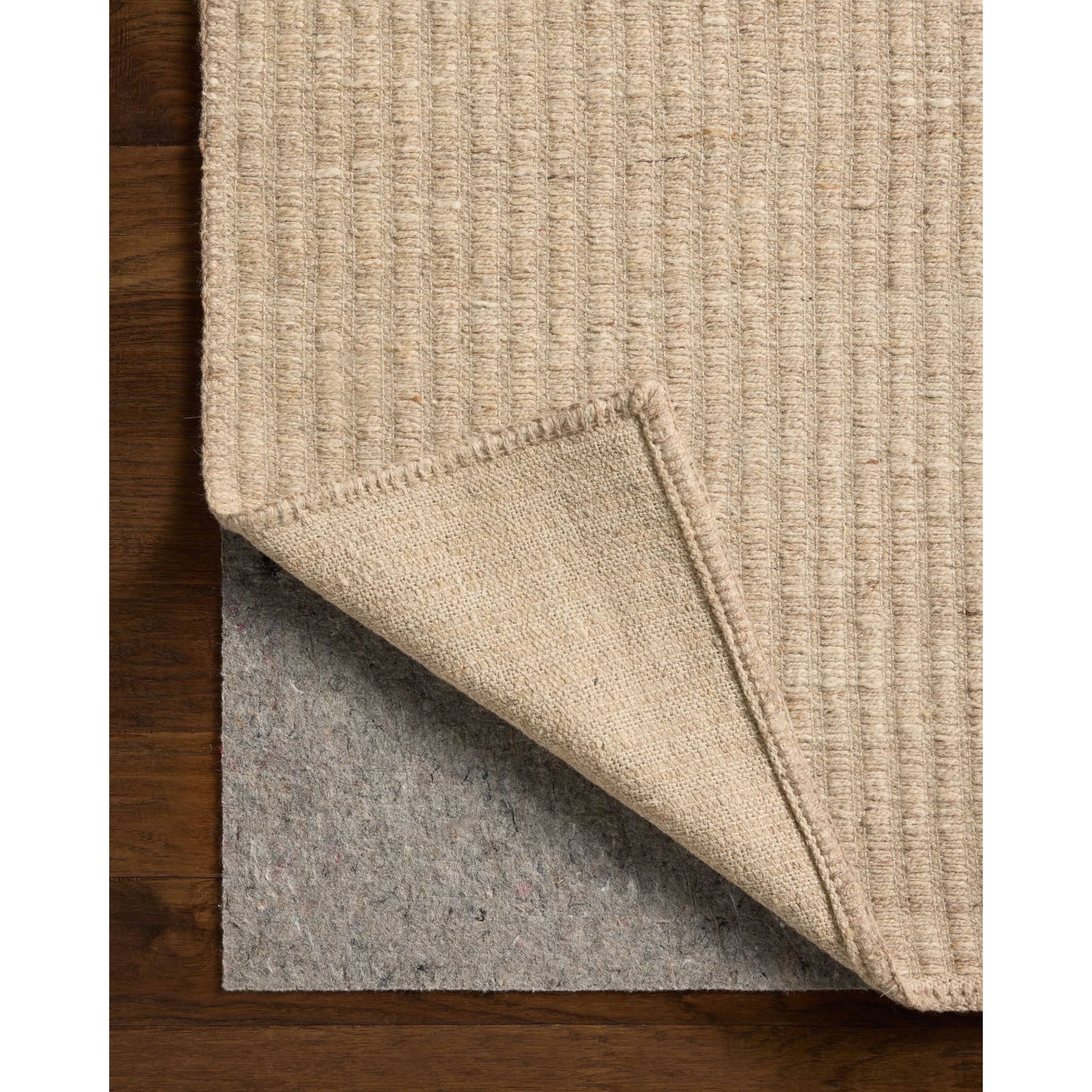 The Elma Collection is a vertically striped area rug framed with whip-stitched edges to help ground your space. This timeless, neutral rug is great for high-traffic living rooms, bedrooms, and dining rooms of many home decor styles. Amethyst Home provides interior design, new home construction design consulting, vintage area rugs, and lighting in the Nashville metro area.