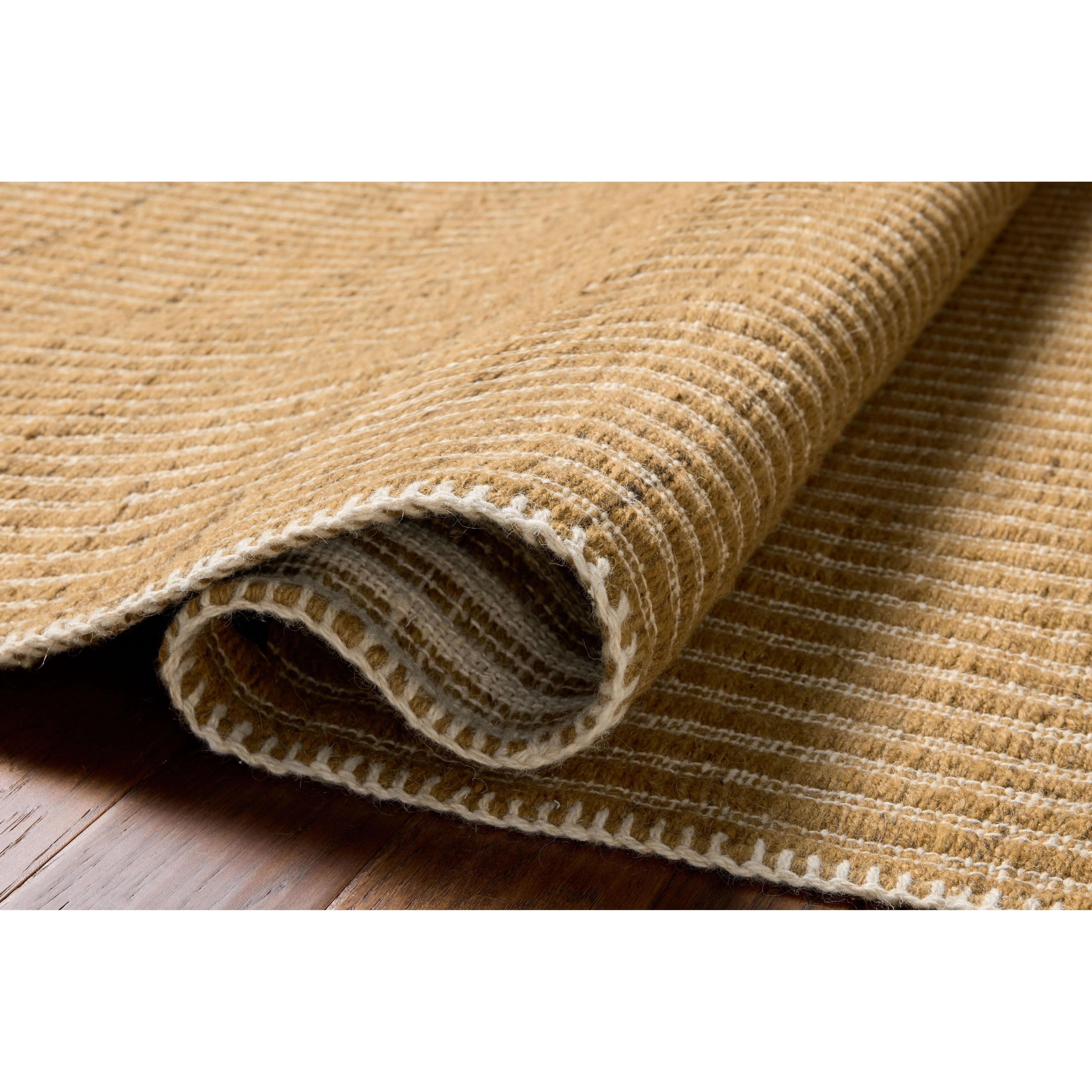 The Elma Collection is a vertically striped area rug framed with whip-stitched edges to help ground your space. This timeless, neutral rug is great for high-traffic living rooms, bedrooms, and dining rooms of many home decor styles. Amethyst Home provides interior design, new home construction design consulting, vintage area rugs, and lighting in the Austin metro area.