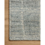 The Hughes Collection is a chunky and soft hand-knotted area rug with a graphic pattern for elevated home decor. The design comes to life with a space-dyed pile that reveals a multitude of beautiful tones, perfect for living rooms, bedrooms, and more high-traffic areas. Amethyst Home provides interior design, new home construction design consulting, vintage area rugs, and lighting in the Charlotte metro area.