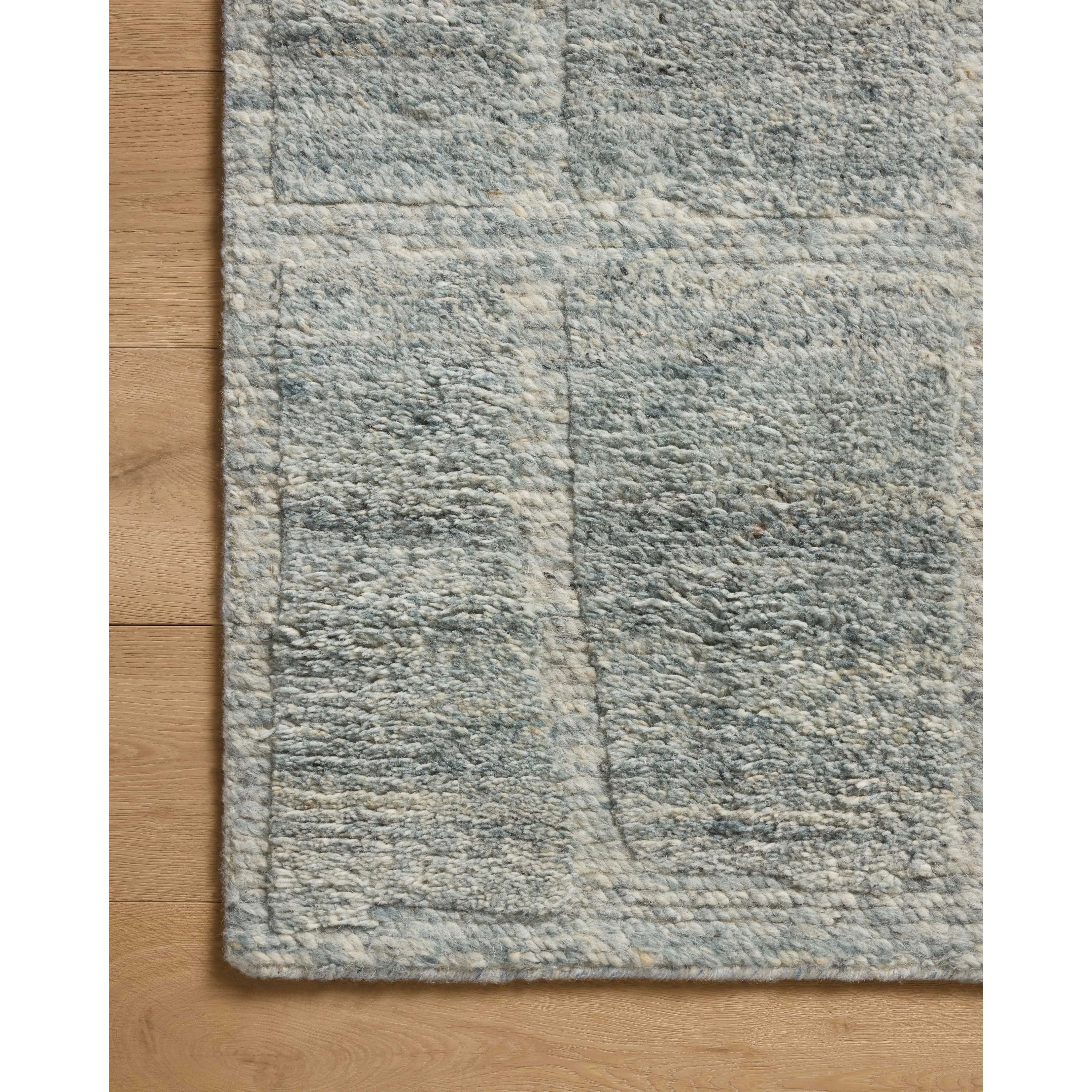 The Hughes Collection is a chunky and soft hand-knotted area rug with a graphic pattern for elevated home decor. The design comes to life with a space-dyed pile that reveals a multitude of beautiful tones, perfect for living rooms, bedrooms, and more high-traffic areas. Amethyst Home provides interior design, new home construction design consulting, vintage area rugs, and lighting in the Charlotte metro area.