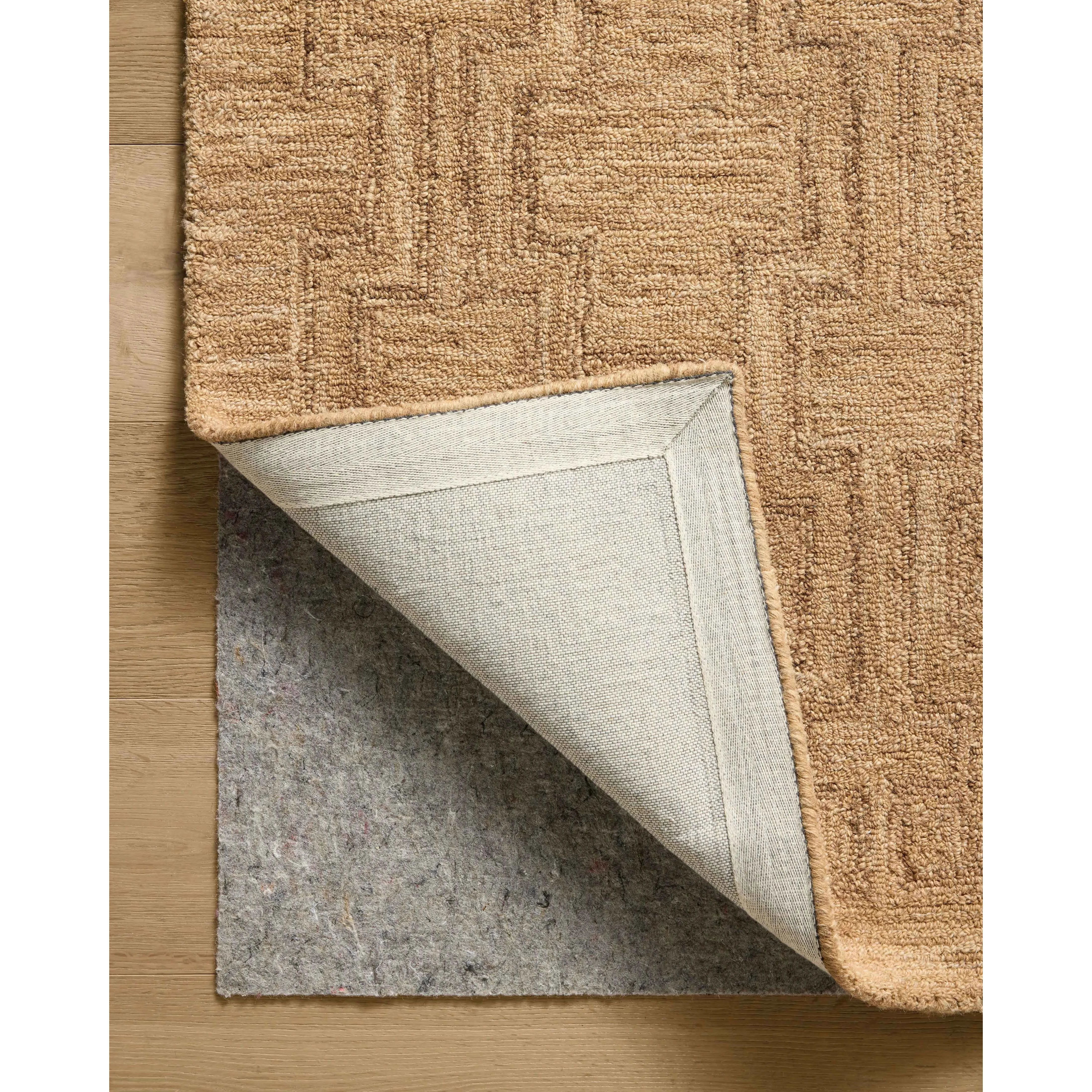 The Barrow Collection by Jeremiah Brent x Loloi is a hand-tufted area rug with a bold linear design inspired by modern art and classical architecture. The rugs pile is a blend of wool and jute for a stable, substantial feel that can ground living rooms, dining rooms, bedrooms, and more. Amethyst Home provides interior design, new home construction design consulting, vintage area rugs, and lighting in the Omaha metro area.