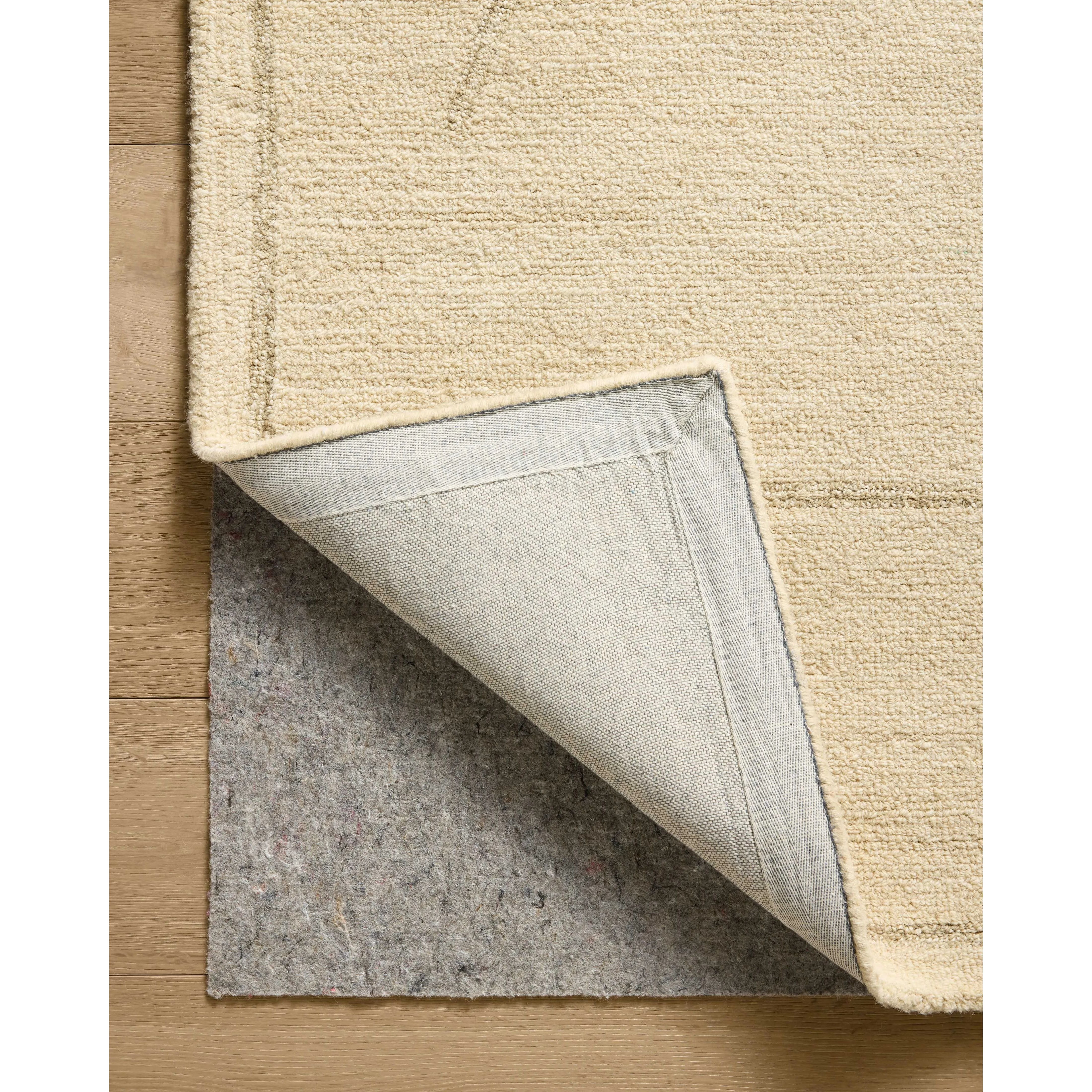 The Barrow Collection by Jeremiah Brent x Loloi is a hand-tufted area rug with a bold linear design inspired by modern art and classical architecture. The rugs pile is a blend of wool and jute for a stable, substantial feel that can ground living rooms, dining rooms, bedrooms, and more. Amethyst Home provides interior design, new home construction design consulting, vintage area rugs, and lighting in the Austin metro area.