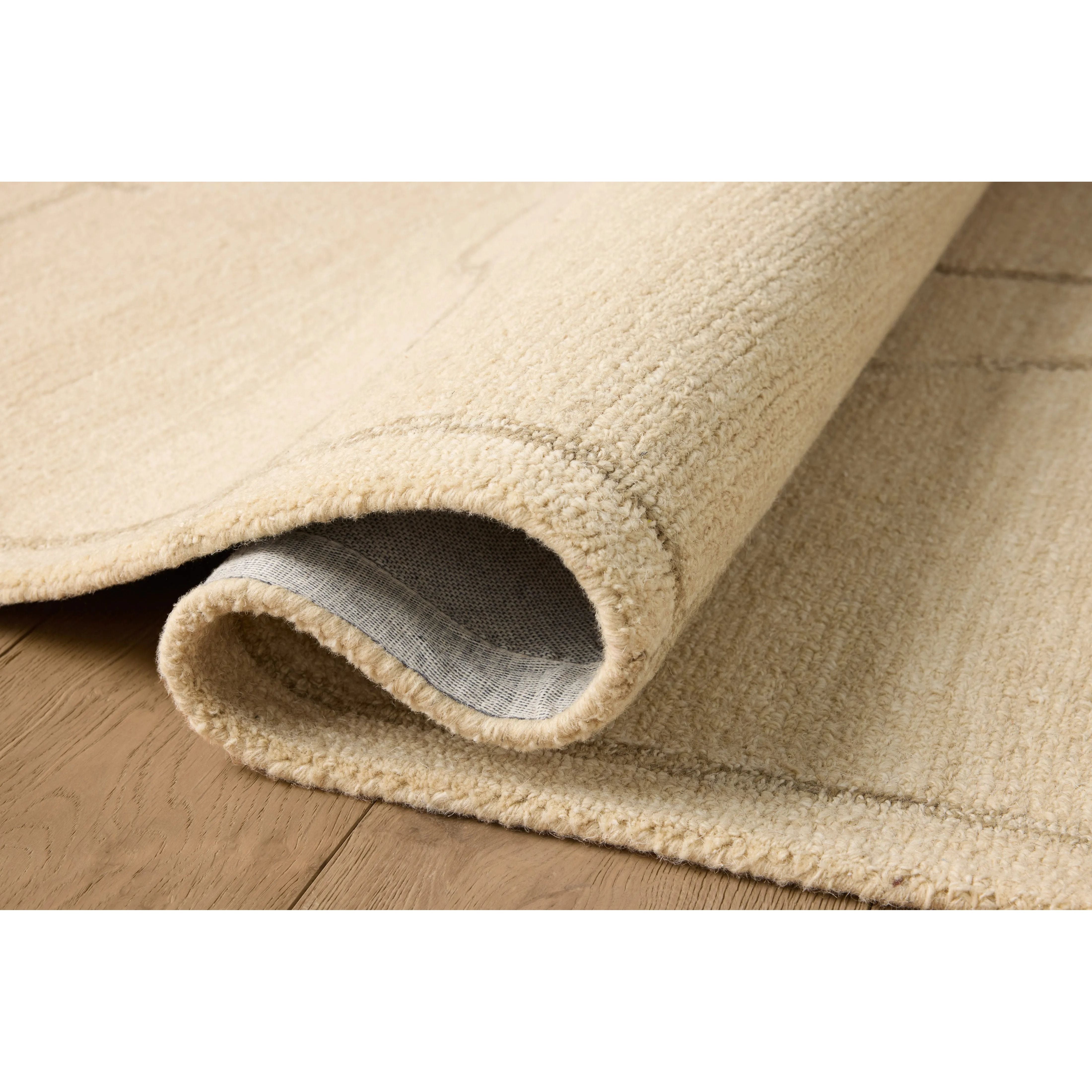 The Barrow Collection by Jeremiah Brent x Loloi is a hand-tufted area rug with a bold linear design inspired by modern art and classical architecture. The rugs pile is a blend of wool and jute for a stable, substantial feel that can ground living rooms, dining rooms, bedrooms, and more. Amethyst Home provides interior design, new home construction design consulting, vintage area rugs, and lighting in the Des Moines metro area.