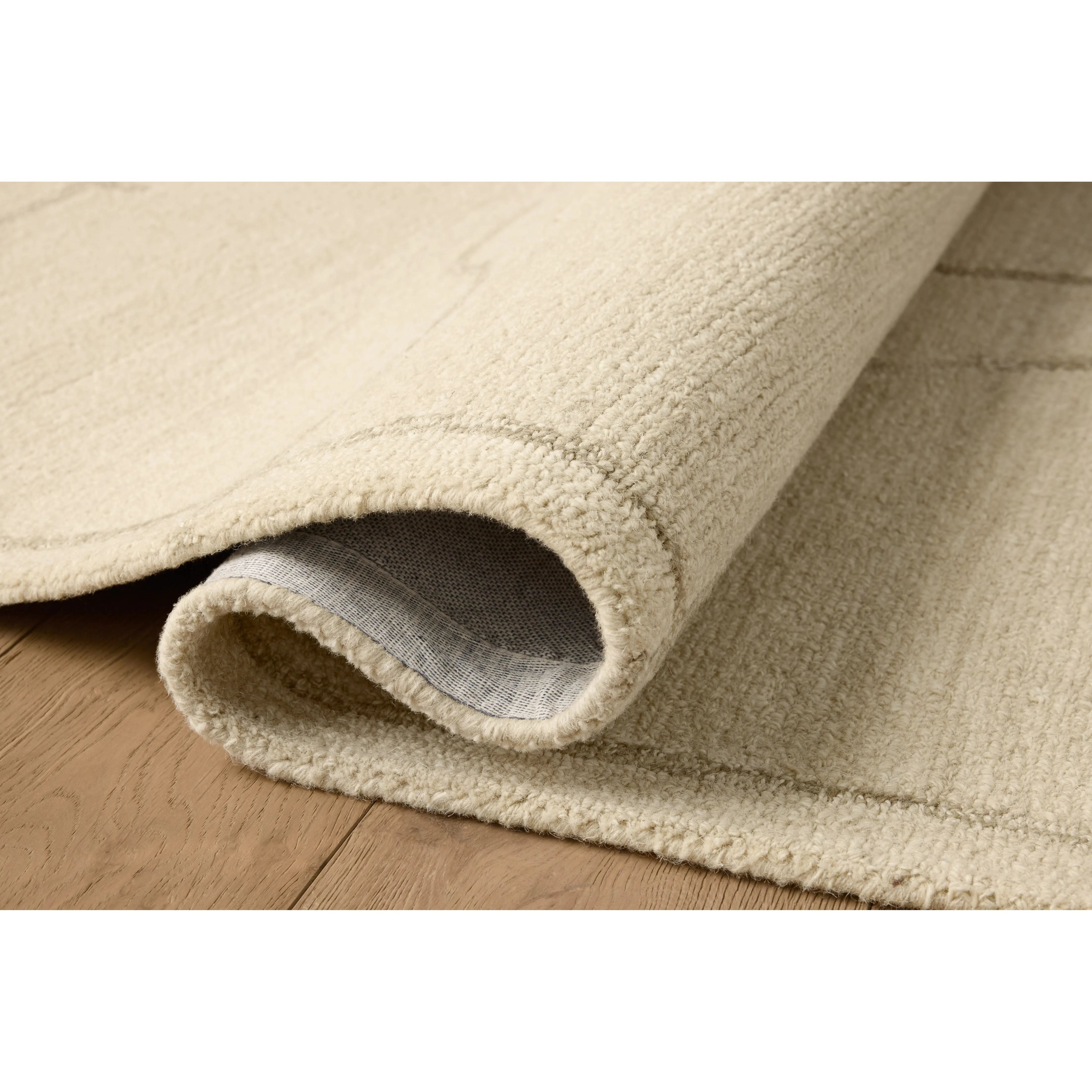 The Barrow Collection by Jeremiah Brent x Loloi is a hand-tufted area rug with a bold linear design inspired by modern art and classical architecture. The rug’s pile is a blend of wool and jute for a stable, substantial feel that can ground living rooms, dining rooms, bedrooms, and more. Amethyst Home provides interior design, new home construction design consulting, vintage area rugs, and lighting in the Laguna Beach metro area.