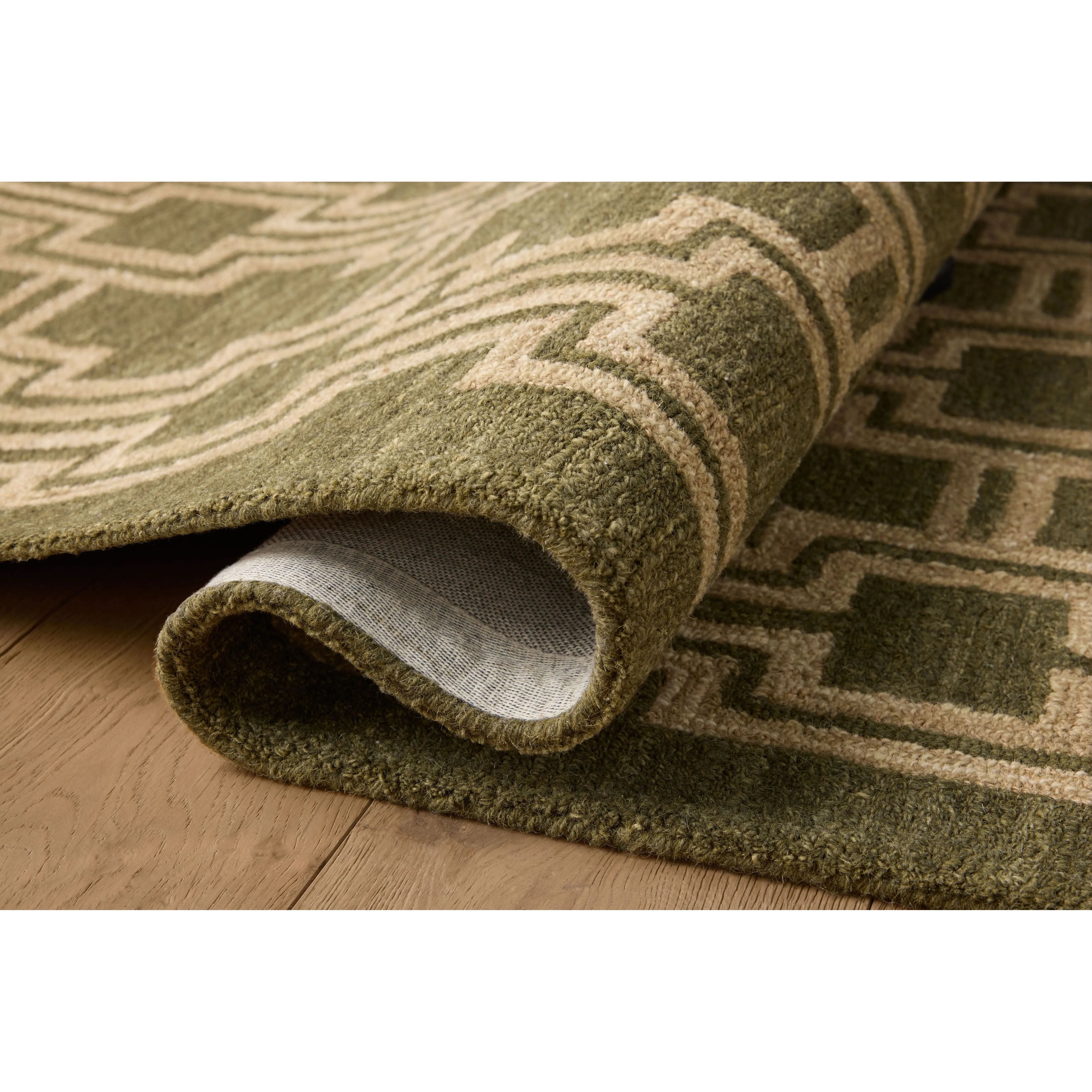 The Barrow Collection by Jeremiah Brent x Loloi is a hand-tufted area rug with a bold linear design inspired by modern art and classical architecture. The rugs pile is a blend of wool and jute for a stable, substantial feel that can ground living rooms, dining rooms, bedrooms, and more. Amethyst Home provides interior design, new home construction design consulting, vintage area rugs, and lighting in the San Diego metro area.