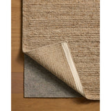 The Lennox Collection by Leanne Ford x Loloi is a statement area rug made with natural undyed wool that reveals subtle color differentiation in creamy neutral tones. The rug is hand-woven with a labor-intensive soumak weave, alternating rows of thick and thin looped yarns for an organic, inviting texture. Amethyst Home provides interior design, new home construction design consulting, vintage area rugs, and lighting in the Charlotte metro area.