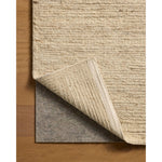 The Lennox Collection by Leanne Ford x Loloi is a statement area rug made with natural undyed wool that reveals subtle color differentiation in creamy neutral tones. The rug is hand-woven with a labor-intensive soumak weave, alternating rows of thick and thin looped yarns for an organic, inviting texture. Amethyst Home provides interior design, new home construction design consulting, vintage area rugs, and lighting in the Charlotte metro area.