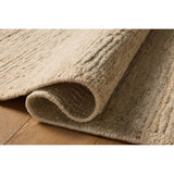 The Lennox Collection by Leanne Ford x Loloi is a statement area rug made with natural undyed wool that reveals subtle color differentiation in creamy neutral tones. The rug is hand-woven with a labor-intensive soumak weave, alternating rows of thick and thin looped yarns for an organic, inviting texture. Amethyst Home provides interior design, new home construction design consulting, vintage area rugs, and lighting in the Nashville metro area.