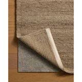 The Lennox Collection by Leanne Ford x Loloi is a statement area rug made with natural undyed wool that reveals subtle color differentiation in creamy neutral tones. The rug is hand-woven with a labor-intensive soumak weave, alternating rows of thick and thin looped yarns for an organic, inviting texture. Amethyst Home provides interior design, new home construction design consulting, vintage area rugs, and lighting in the Laguna Beach metro area.