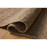 The Lennox Collection by Leanne Ford x Loloi is a statement area rug made with natural undyed wool that reveals subtle color differentiation in creamy neutral tones. The rug is hand-woven with a labor-intensive soumak weave, alternating rows of thick and thin looped yarns for an organic, inviting texture. Amethyst Home provides interior design, new home construction design consulting, vintage area rugs, and lighting in the Los Angeles metro area.