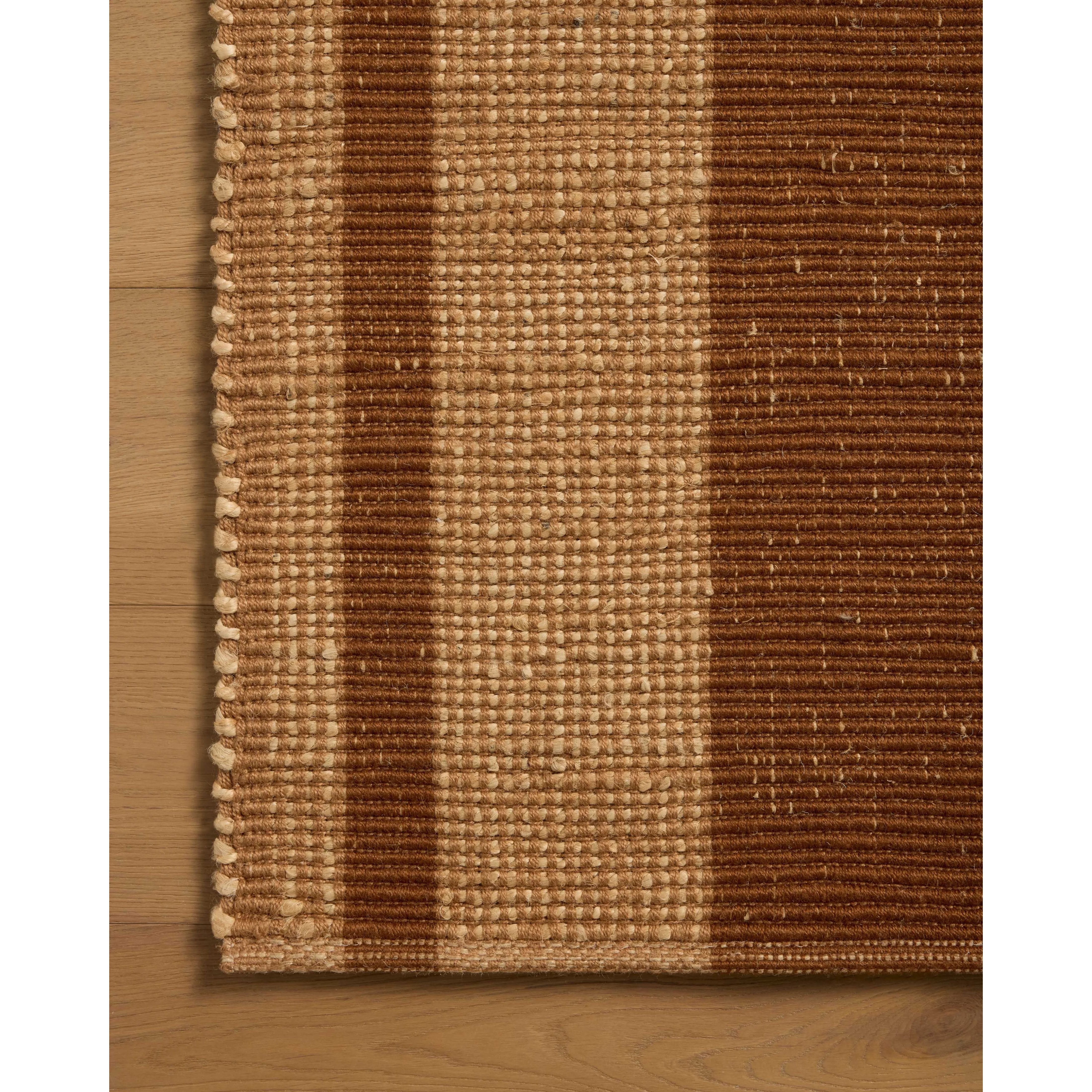 The Weatherstaff Collection is a vertically striped jute area rug with an organic look and feel, designed by Leanne Ford x Loloi. The earth-toned area rug features flatwoven jute that creates a ribbed texture horizontally, with stripes that are vertical—a playful combination. Amethyst Home provides interior design, new home construction design consulting, vintage area rugs, and lighting in the Tampa metro area.