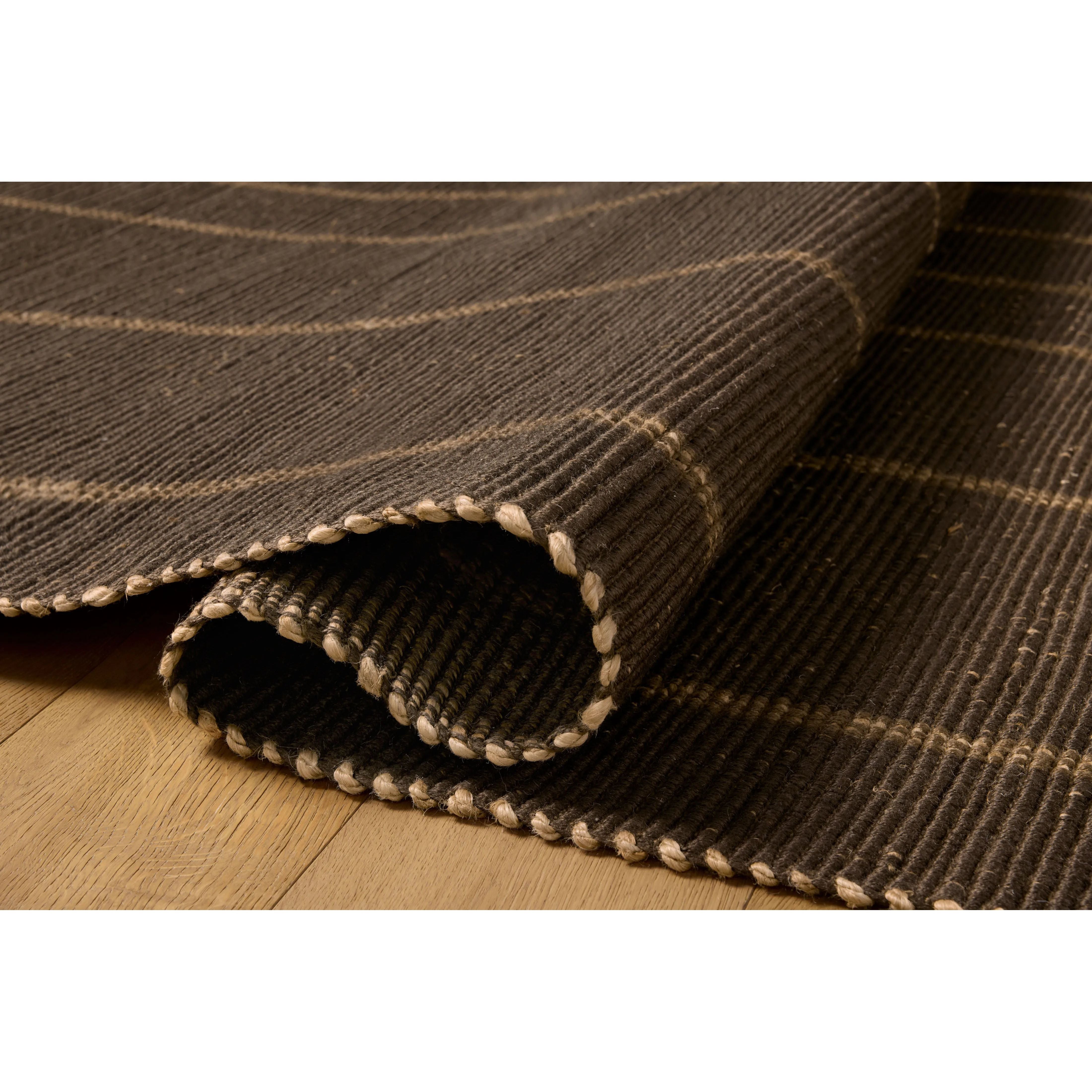 The Weatherstaff Collection is a vertically striped jute area rug with an organic look and feel, designed by Leanne Ford x Loloi. The earth-toned area rug features flatwoven jute that creates a ribbed texture horizontally, with stripes that are vertical—a playful combination. Amethyst Home provides interior design, new home construction design consulting, vintage area rugs, and lighting in the Des Moines metro area.