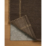 The Weatherstaff Collection is a vertically striped jute area rug with an organic look and feel, designed by Leanne Ford x Loloi. The earth-toned area rug features flatwoven jute that creates a ribbed texture horizontally, with stripes that are vertical—a playful combination. Amethyst Home provides interior design, new home construction design consulting, vintage area rugs, and lighting in the Tampa metro area.