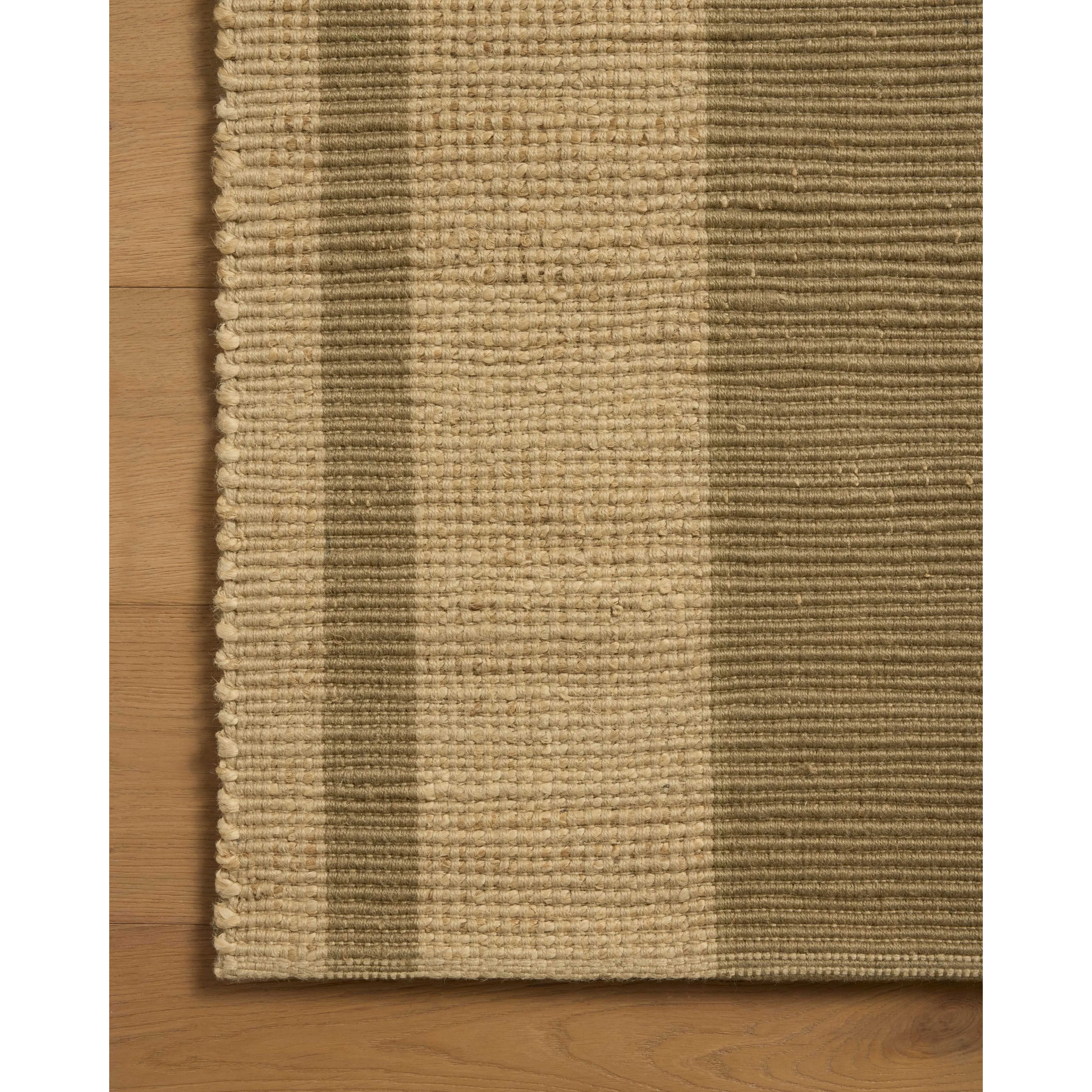 The Weatherstaff Collection is a vertically striped jute area rug with an organic look and feel, designed by Leanne Ford x Loloi. The earth-toned area rug features flatwoven jute that creates a ribbed texture horizontally, with stripes that are vertical—a playful combination. Amethyst Home provides interior design, new home construction design consulting, vintage area rugs, and lighting in the Charlotte metro area.