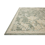 The Lenore Collection is a floral wool area rug with a two-toned design for elegant home decor. The rug's intricate linework is cut pile and the base is looped yarn, which gives the florals a slightly raised appearance and lovely depth. Amethyst Home provides interior design, new home construction design consulting, vintage area rugs, and lighting in the Newport Beach metro area.