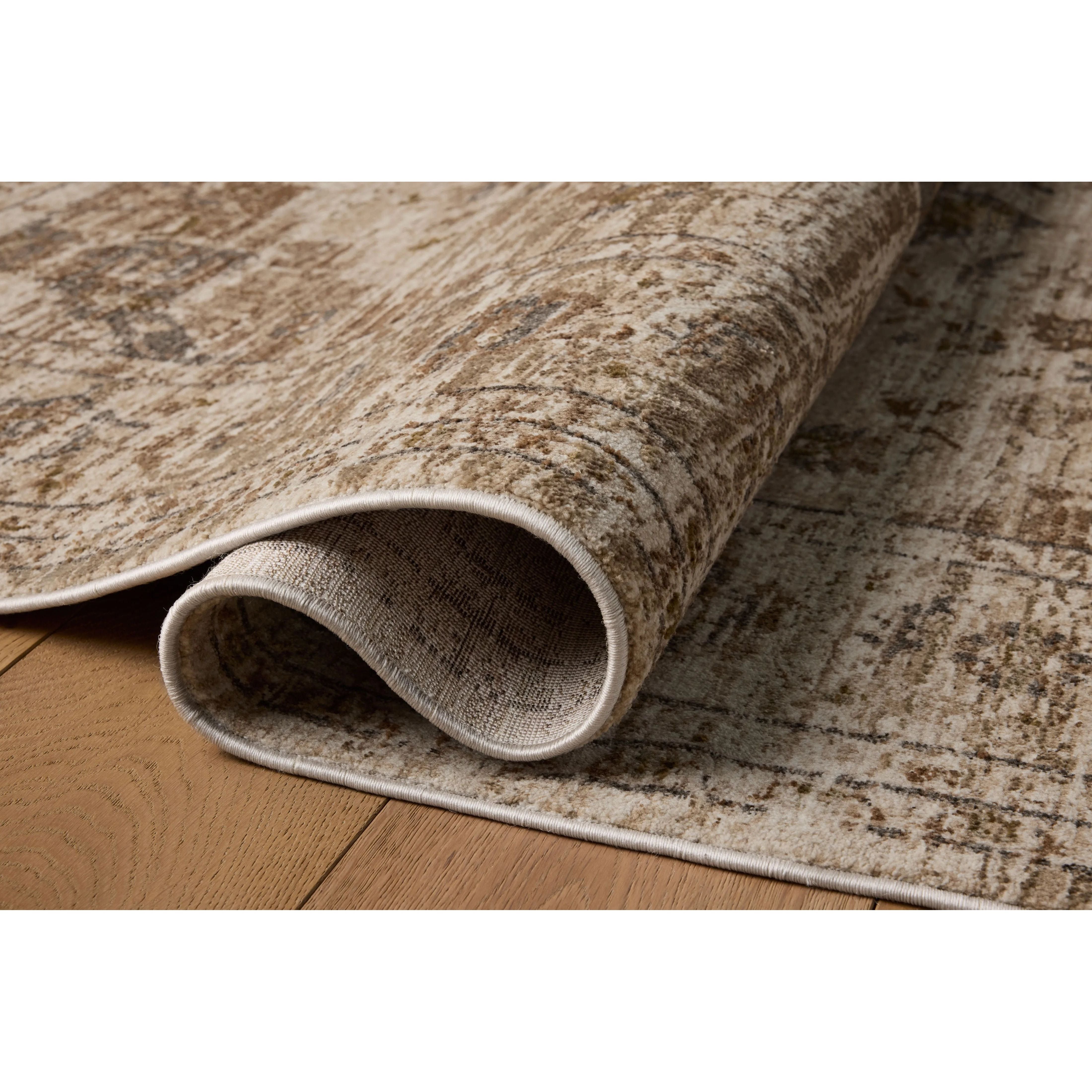 The Haywood Collection is an easy-to-clean, earth-toned area rug with a subtly distressed traditional design. Haywood is power-loomed of polyester in Turkey, a durable area rug for a living room, bedroom, dining room, or other high-traffic spaces. Amethyst Home provides interior design, new home construction design consulting, vintage area rugs, and lighting in the Omaha metro area.