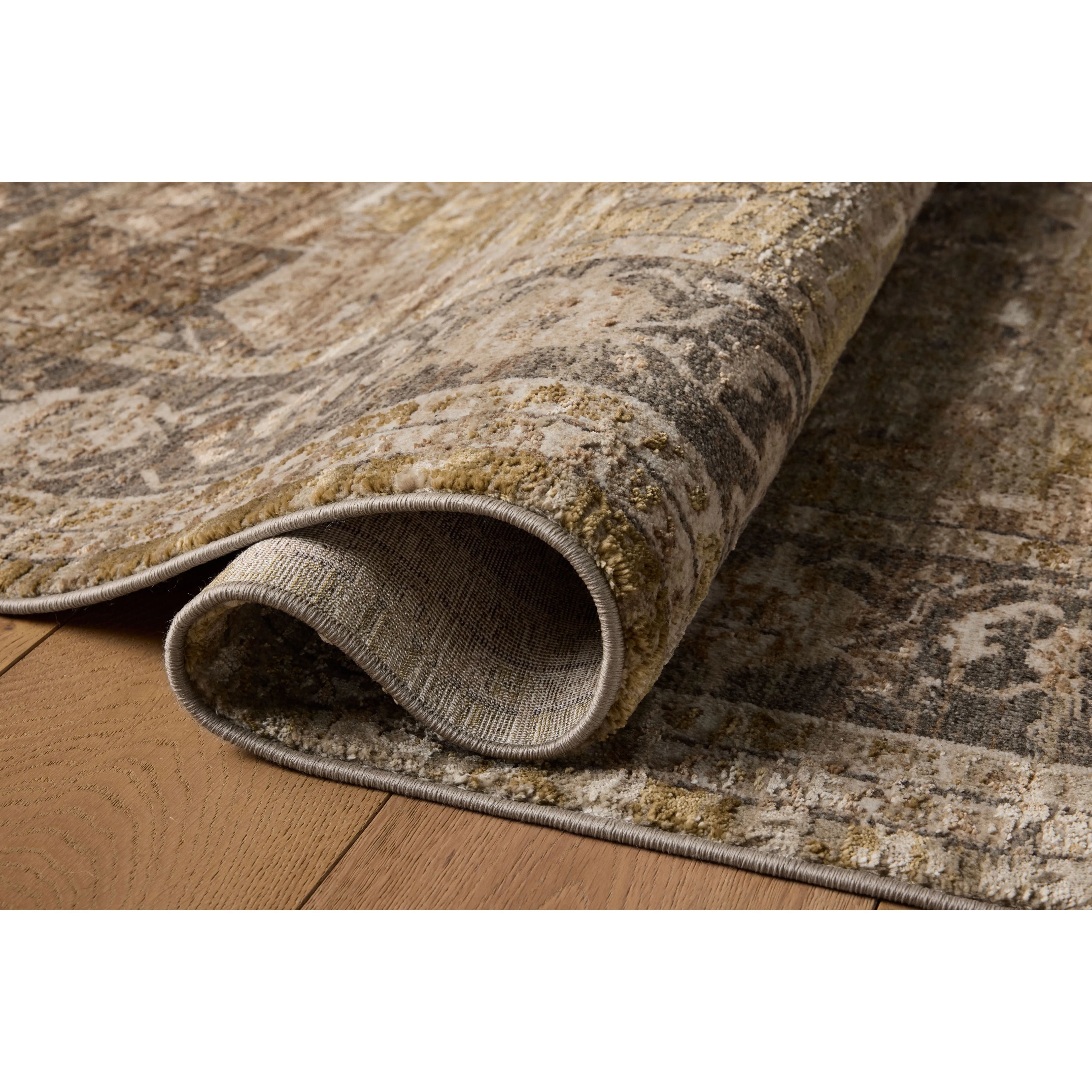 The Haywood Collection is an easy-to-clean, earth-toned area rug with a subtly distressed traditional design. Haywood is power-loomed of polyester in Turkey, a durable area rug for a living room, bedroom, dining room, or other high-traffic spaces. Amethyst Home provides interior design, new home construction design consulting, vintage area rugs, and lighting in the Newport Beach metro area.