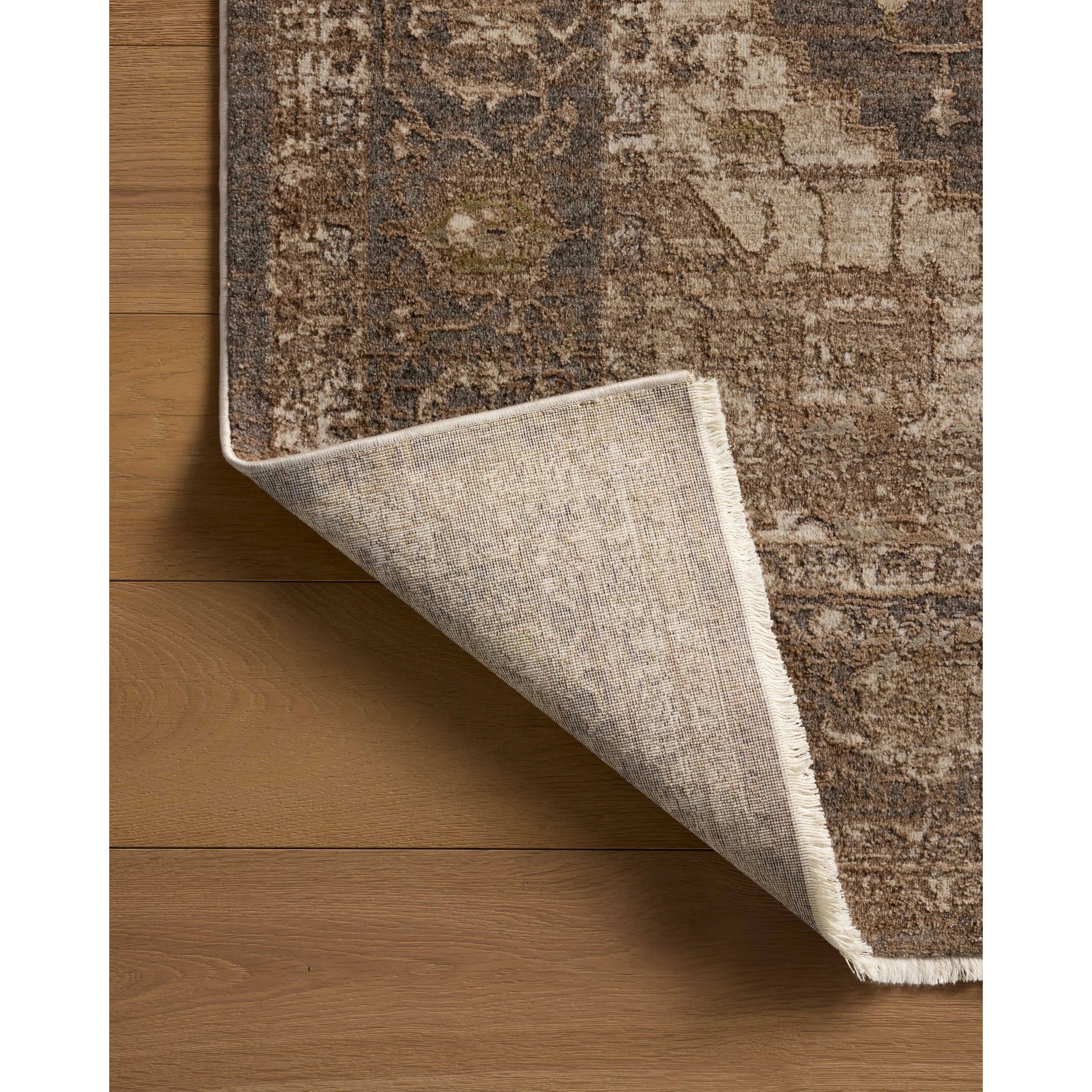 The Haywood Collection is an easy-to-clean, earth-toned area rug with a subtly distressed traditional design. Haywood is power-loomed of polyester in Turkey, a durable area rug for a living room, bedroom, dining room, or other high-traffic spaces. Amethyst Home provides interior design, new home construction design consulting, vintage area rugs, and lighting in the Austin metro area.