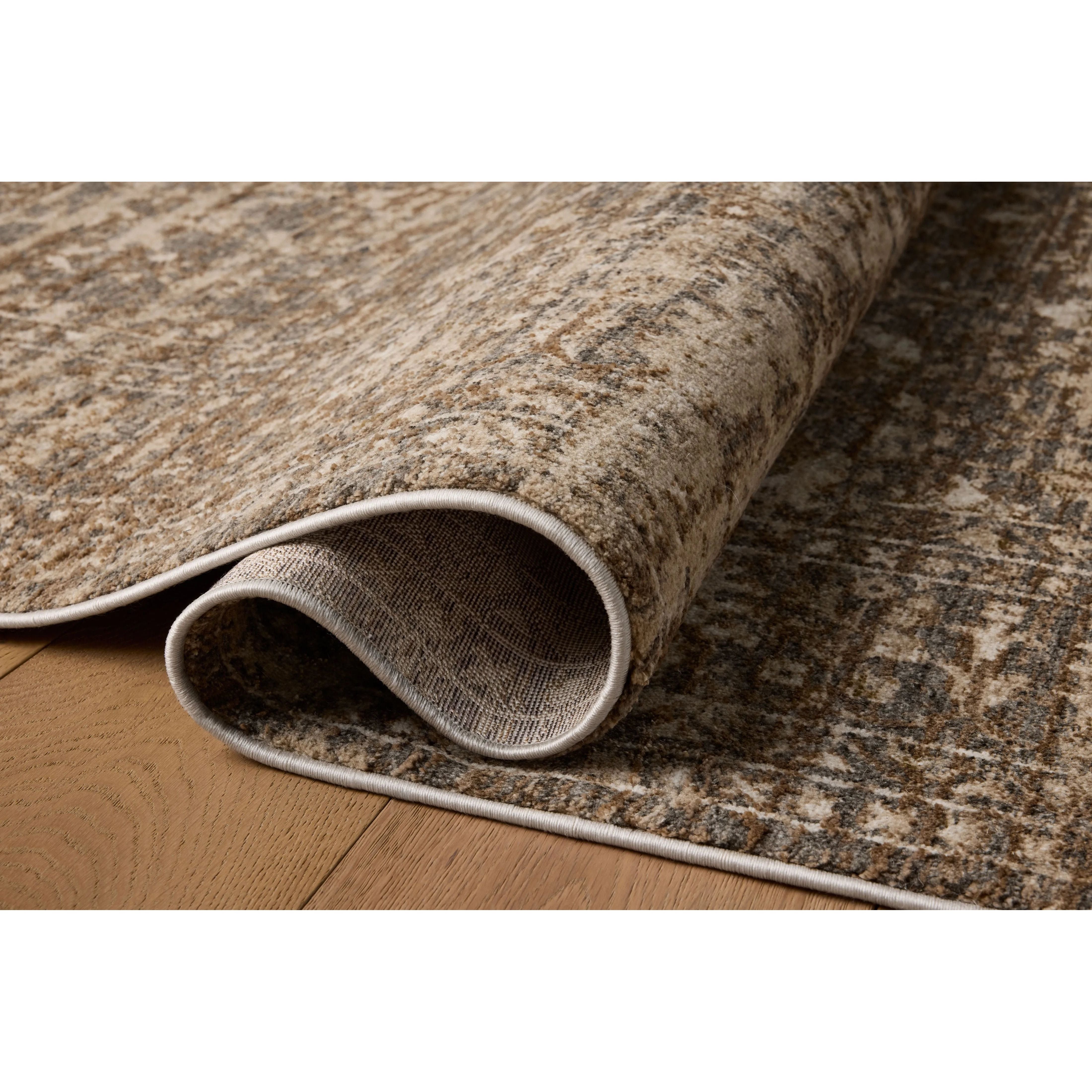 The Haywood Collection is an easy-to-clean, earth-toned area rug with a subtly distressed traditional design. Haywood is power-loomed of polyester in Turkey, a durable area rug for a living room, bedroom, dining room, or other high-traffic spaces. Amethyst Home provides interior design, new home construction design consulting, vintage area rugs, and lighting in the Newport Beach metro area.