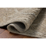 The Mabel Collection is a chunky wool area rug with a modernized take on traditional Turkish design. The rugs pattern rises with a higher pile for added dimension, while the neutral stone palette makes it easy to style in living rooms, bedrooms, and more. Amethyst Home provides interior design, new home construction design consulting, vintage area rugs, and lighting in the Austin metro area.