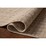 The Maren Collection is a unique handmade area rug made with a new technique that creates a dotted texture, almost like fine embroidery, but with a substantial hand-loomed feel. The pile reveals modern geometric patterns with organic shapes and natural softness, available in light, easygoing neutrals. Amethyst Home provides interior design, new home construction design consulting, vintage area rugs, and lighting in the Omaha metro area.