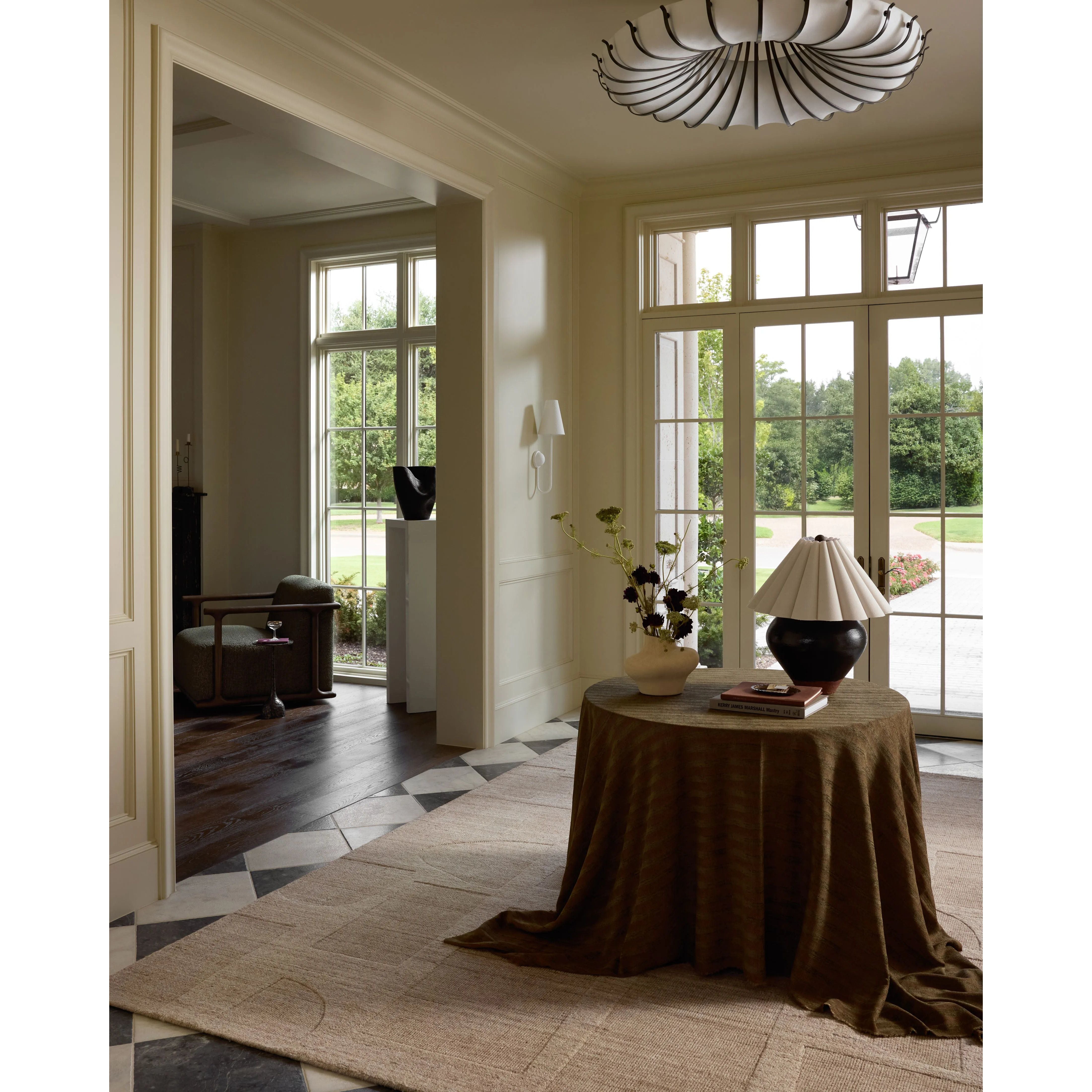 The Maren Collection is a unique handmade area rug made with a new technique that creates a dotted texture, almost like fine embroidery, but with a substantial hand-loomed feel. The pile reveals modern geometric patterns with organic shapes and natural softness, available in light, easygoing neutrals. Amethyst Home provides interior design, new home construction design consulting, vintage area rugs, and lighting in the Omaha metro area.