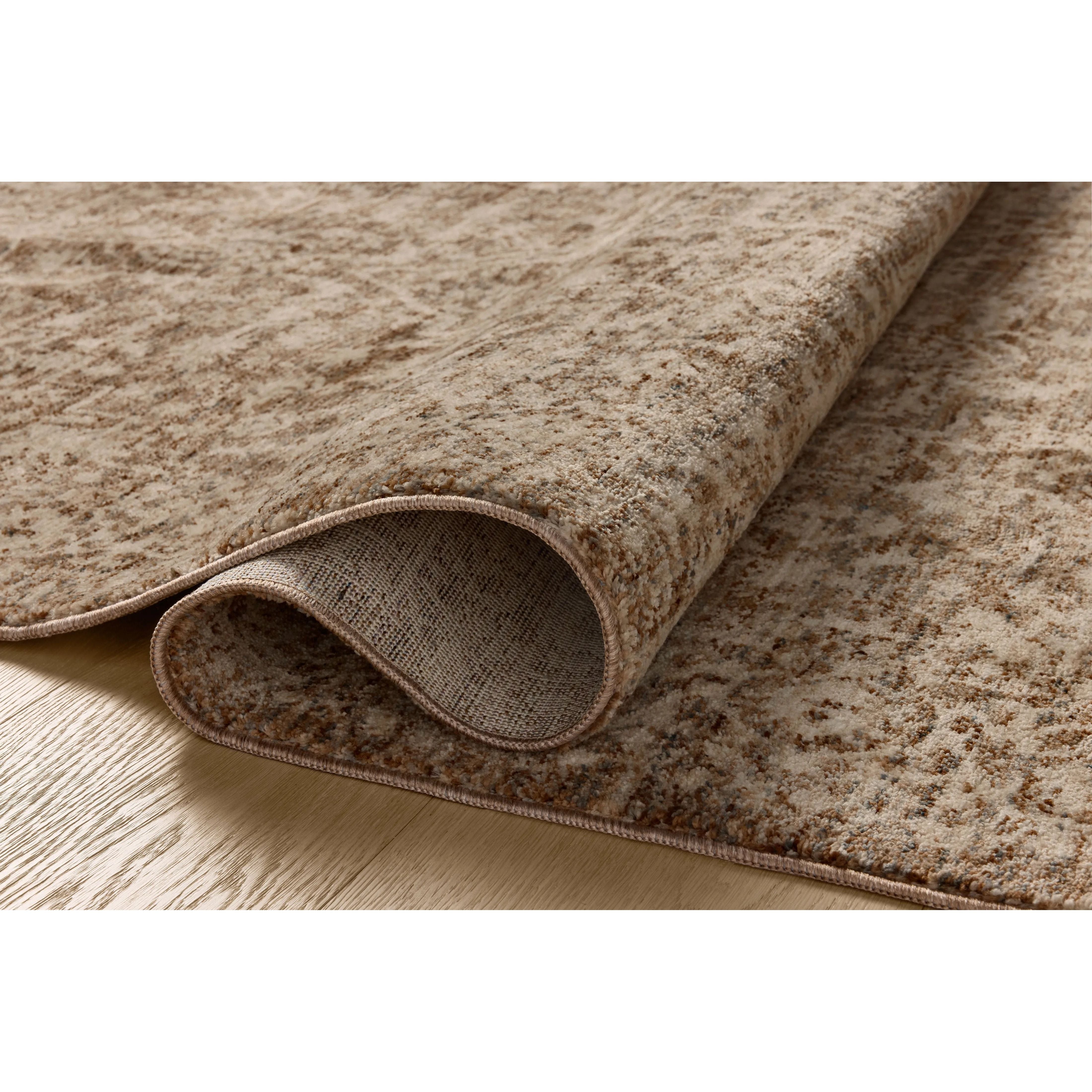 The Newman Collection is a power-loomed area rug made of soft space-dyed polyester, which lends a subtle gradation of color in an easy-to-clean, no-shed construction. The versatile, vintage-inspired design features distressed white motifs against lovely and light tonal backgrounds. Amethyst Home provides interior design, new home construction design consulting, vintage area rugs, and lighting in the Laguna Beach metro area.