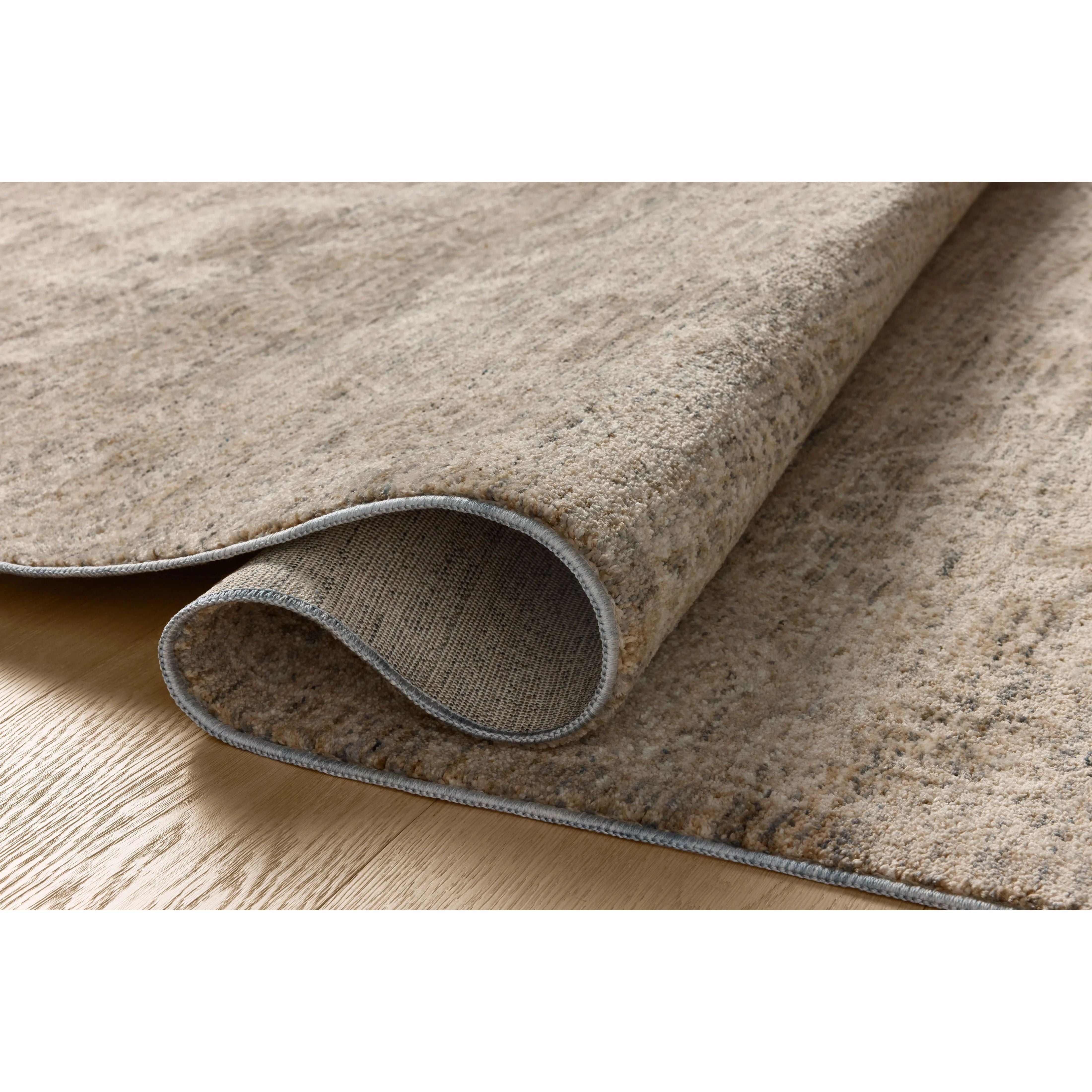 The Newman Collection is a power-loomed area rug made of soft space-dyed polyester, which lends a subtle gradation of color in an easy-to-clean, no-shed construction. The versatile, vintage-inspired design features distressed white motifs against lovely and light tonal backgrounds. Amethyst Home provides interior design, new home construction design consulting, vintage area rugs, and lighting in the Tampa metro area.