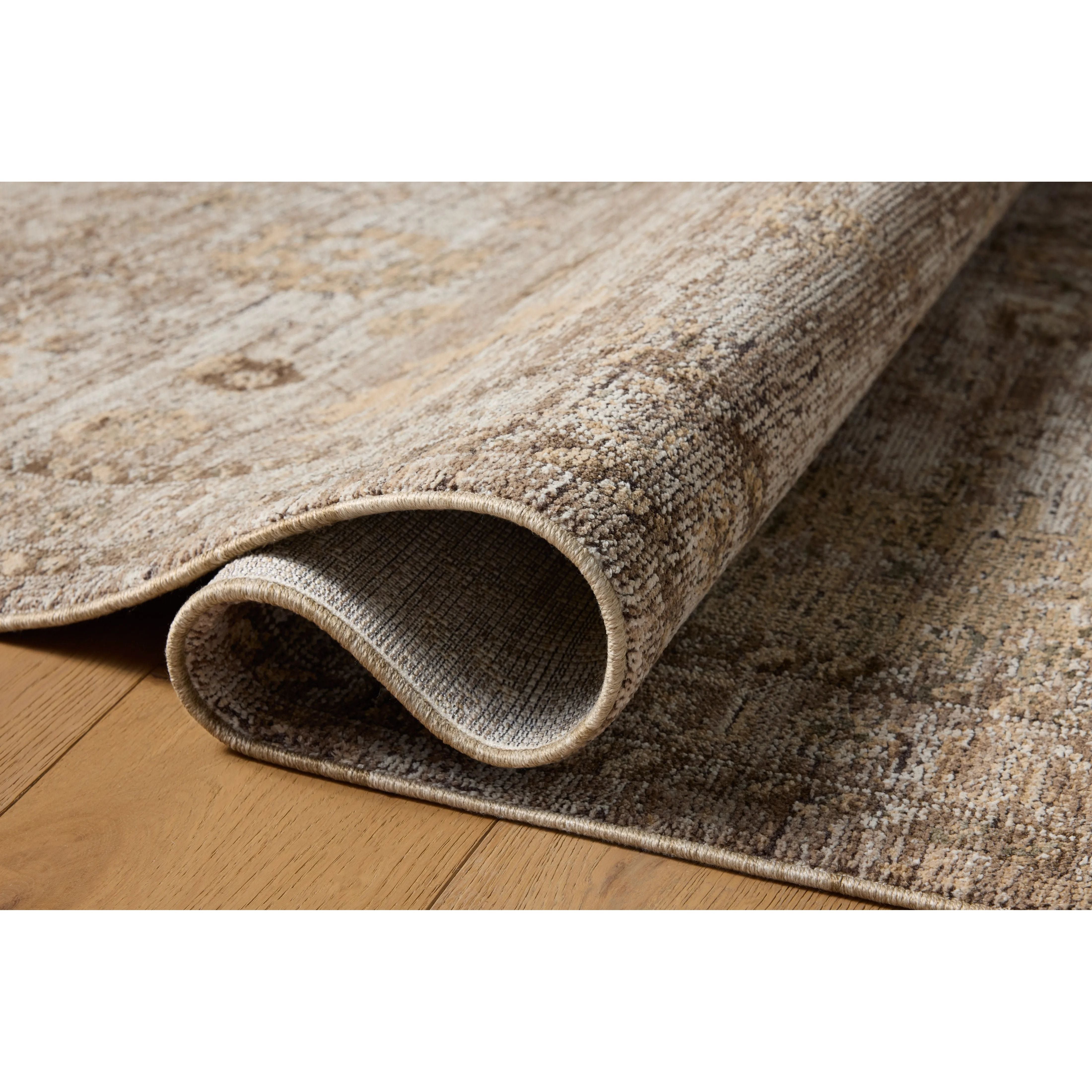Featuring Priscilla Sand / Earth Rug by Loloi at Amethyst Home. Transform your living space into a luxurious retreat with the Priscilla Bark/Ivory Rug. Made of premium materials, this rug adds elegance and sophistication to any room. Its soft, textured surface and neutral color palette create a cozy and inviting atmosphere. Elevate your home decor with this. Amethyst Home provides interior design, new home construction design consulting, vintage area rugs, and lighting in the Nashville metro area.