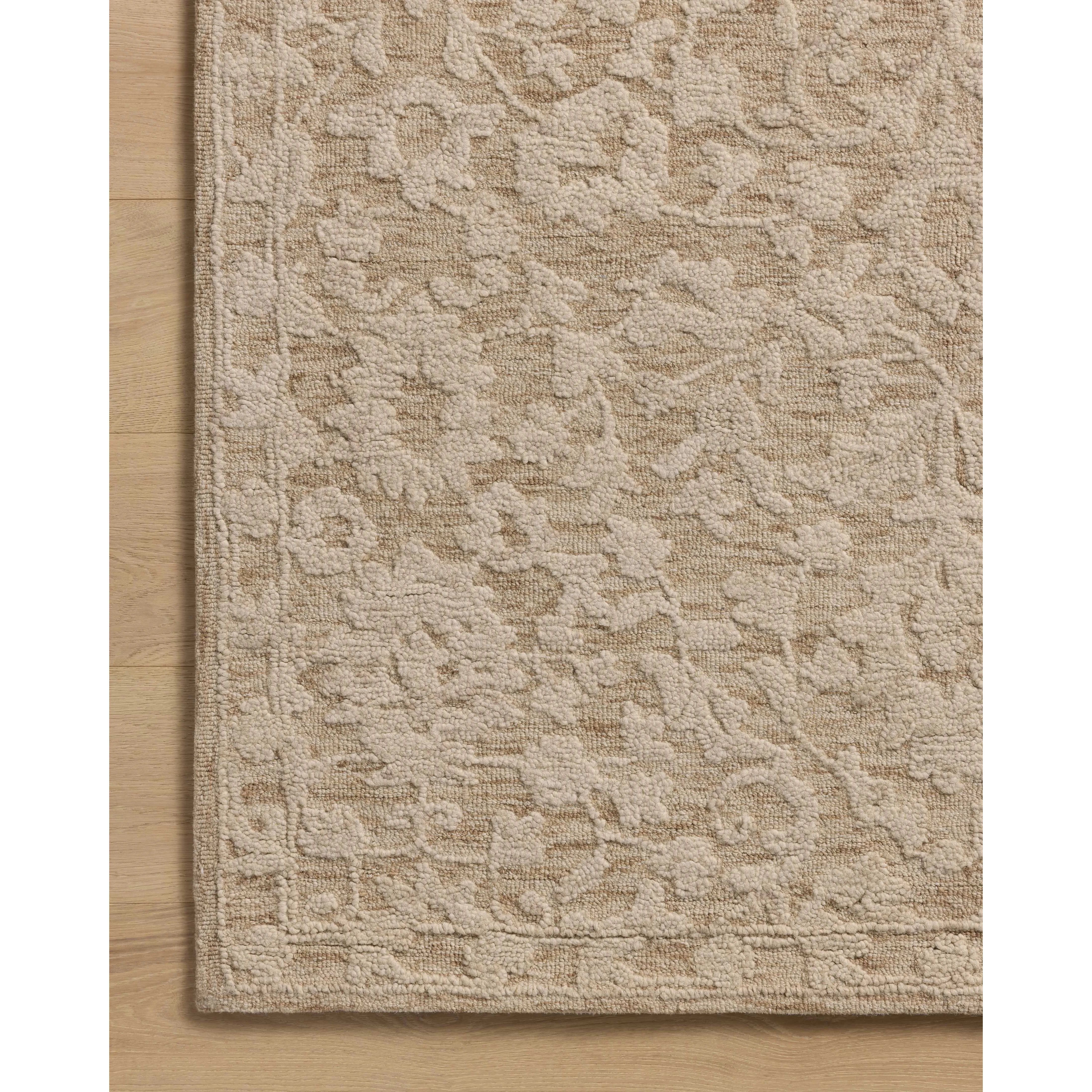 The Prudence Collection is a hand-tufted area rug made of soft, space-dyed wool and cotton, which lends a subtle gradation of color throughout the floral design. The rugs background is low-looped, while the pattern is made with a chunky, higher loop to create even more depth in this sophisticated design. Amethyst Home provides interior design, new home construction design consulting, vintage area rugs, and lighting in the Park City metro area.