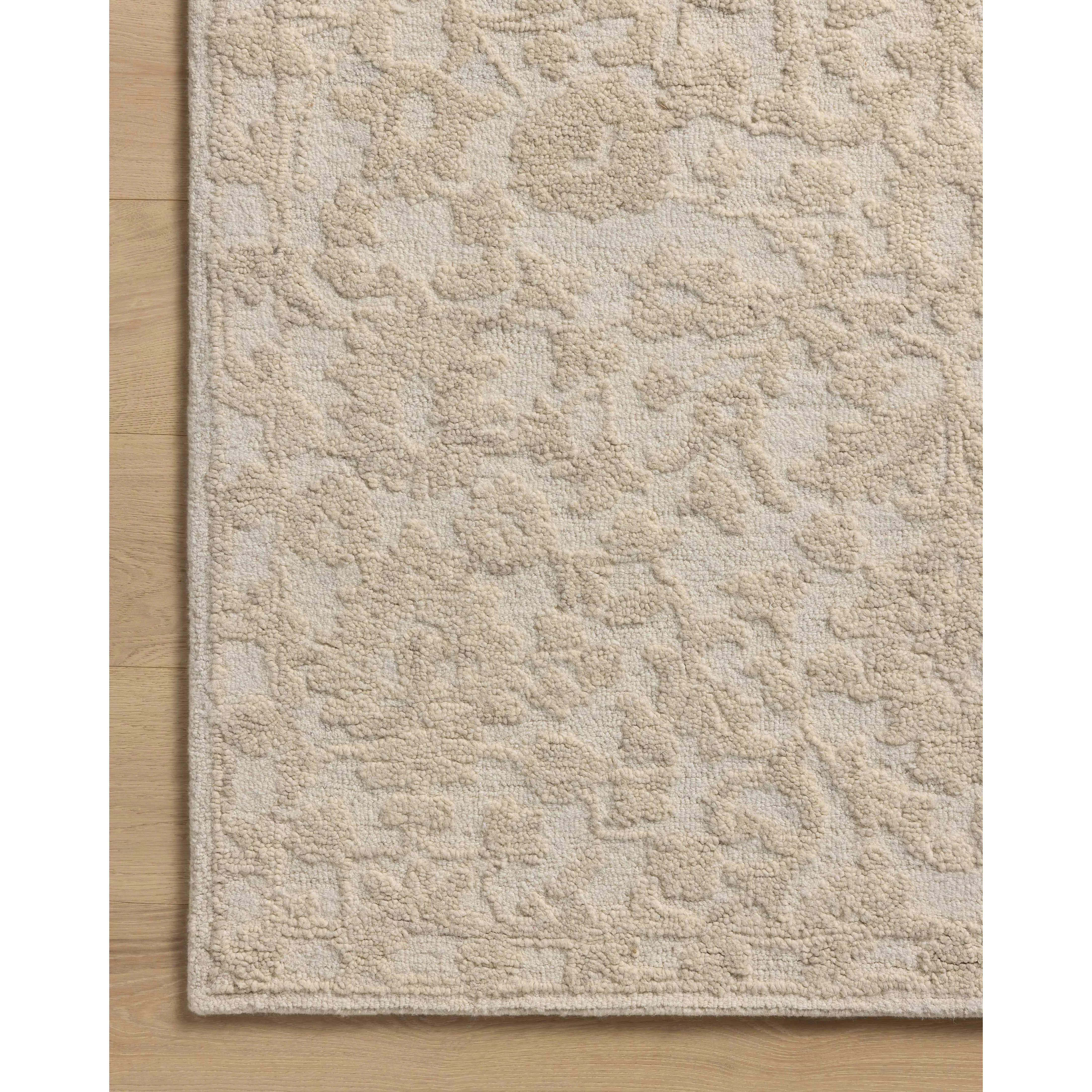 The Prudence Collection is a hand-tufted area rug made of soft, space-dyed wool and cotton, which lends a subtle gradation of color throughout the floral design. The rugs background is low-looped, while the pattern is made with a chunky, higher loop to create even more depth in this sophisticated design. Amethyst Home provides interior design, new home construction design consulting, vintage area rugs, and lighting in the Miami metro area.
