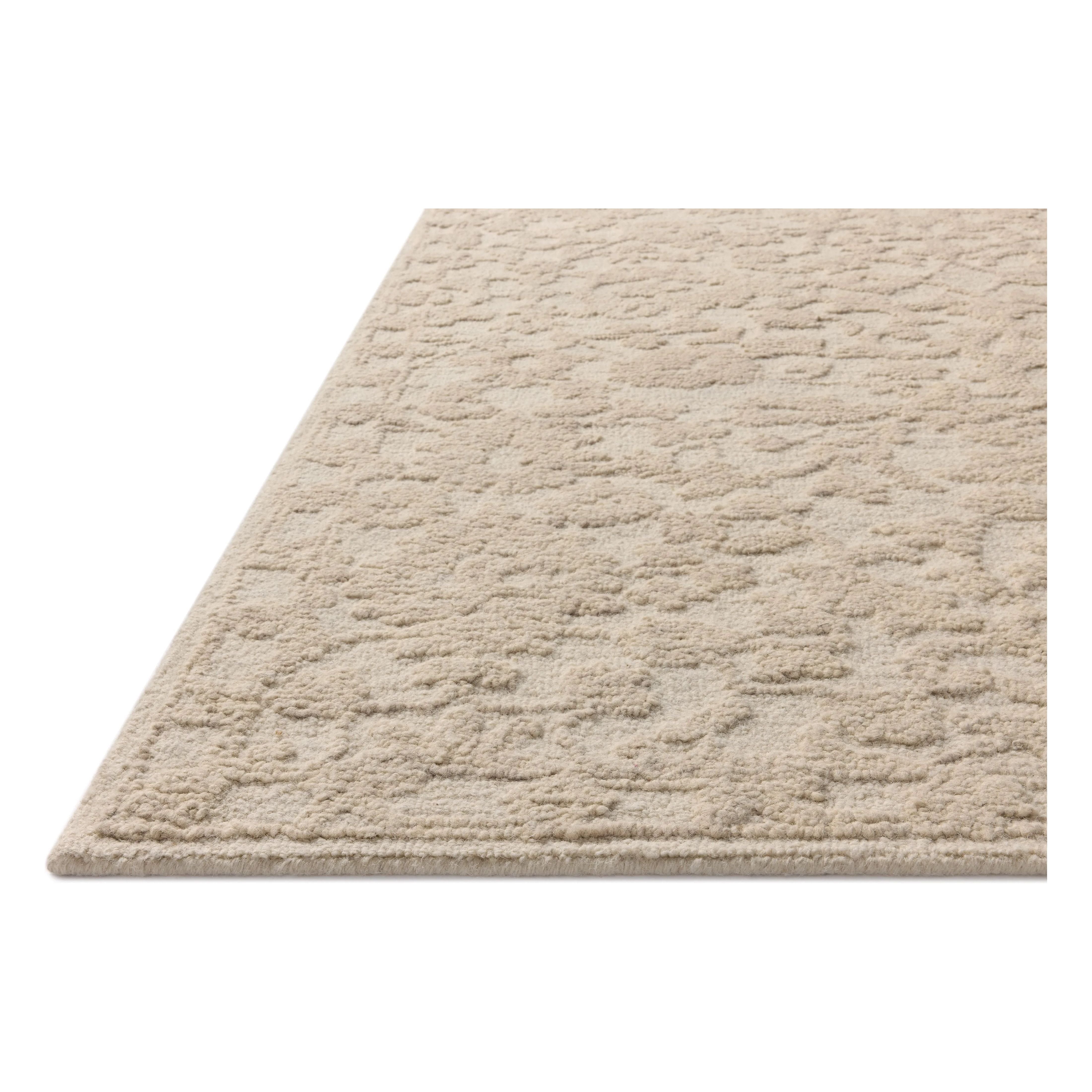 The Prudence Collection is a hand-tufted area rug made of soft, space-dyed wool and cotton, which lends a subtle gradation of color throughout the floral design. The rugs background is low-looped, while the pattern is made with a chunky, higher loop to create even more depth in this sophisticated design. Amethyst Home provides interior design, new home construction design consulting, vintage area rugs, and lighting in the San Diego metro area.