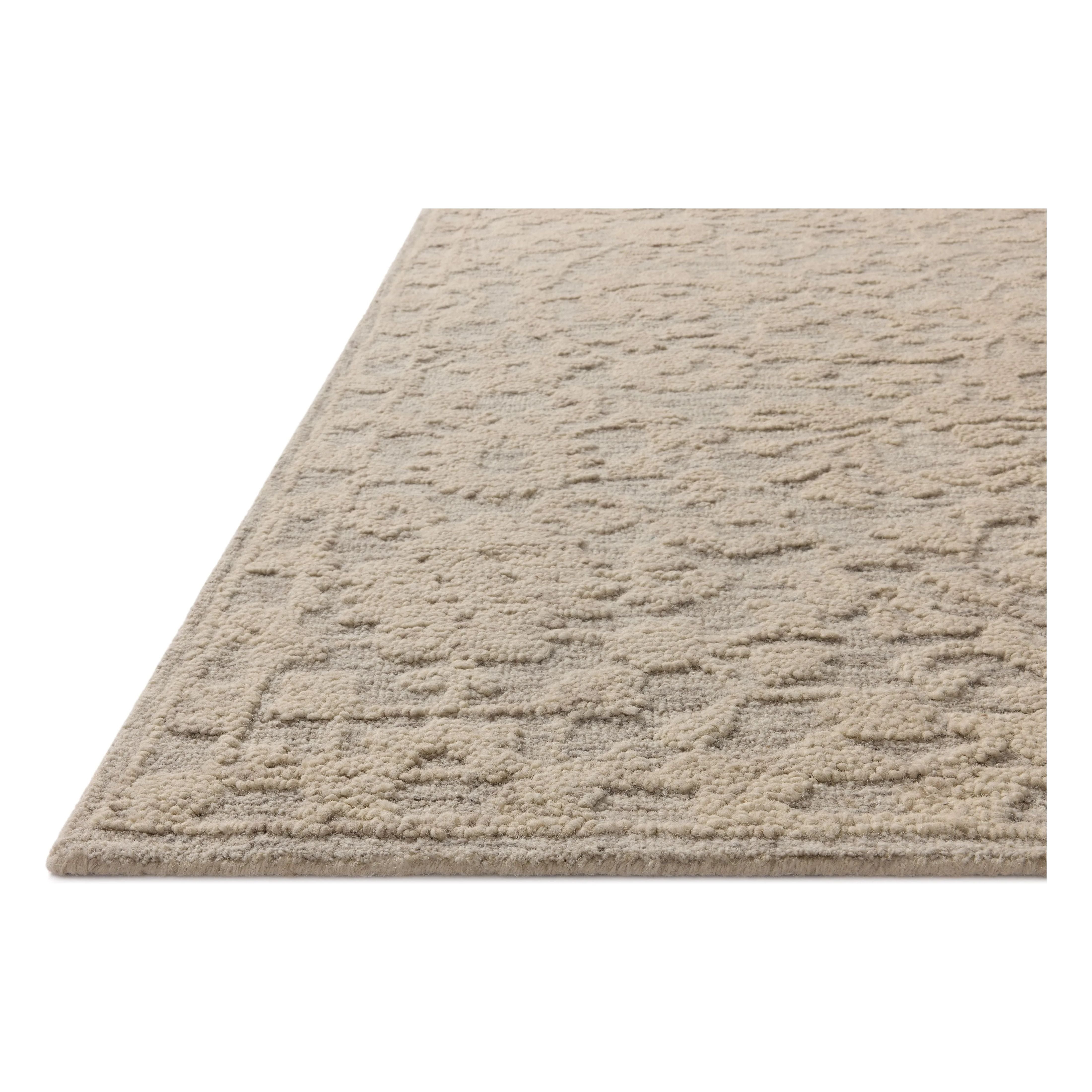 The Prudence Collection is a hand-tufted area rug made of soft, space-dyed wool and cotton, which lends a subtle gradation of color throughout the floral design. The rugs background is low-looped, while the pattern is made with a chunky, higher loop to create even more depth in this sophisticated design. Amethyst Home provides interior design, new home construction design consulting, vintage area rugs, and lighting in the Des Moines metro area.