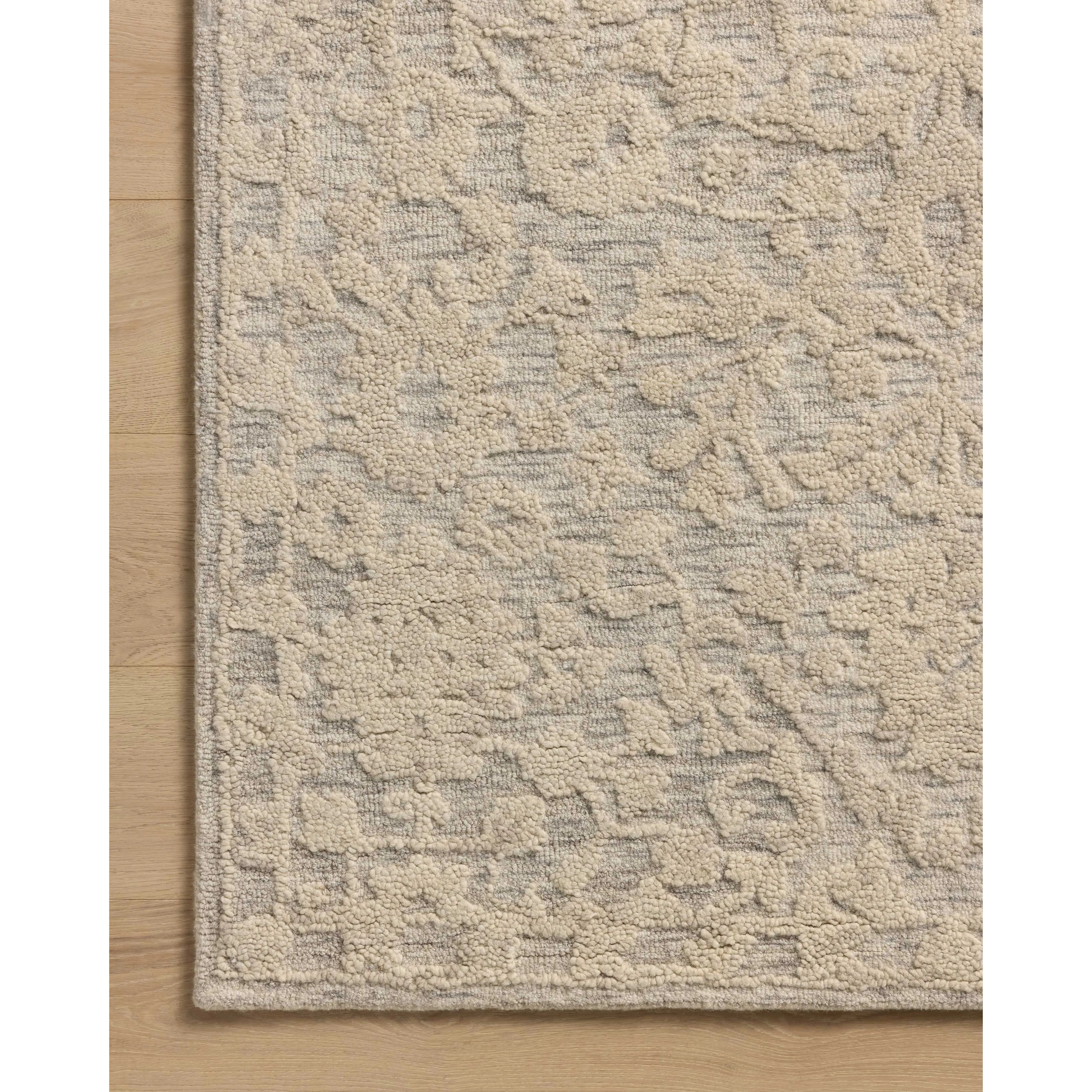The Prudence Collection is a hand-tufted area rug made of soft, space-dyed wool and cotton, which lends a subtle gradation of color throughout the floral design. The rugs background is low-looped, while the pattern is made with a chunky, higher loop to create even more depth in this sophisticated design. Amethyst Home provides interior design, new home construction design consulting, vintage area rugs, and lighting in the Miami metro area.