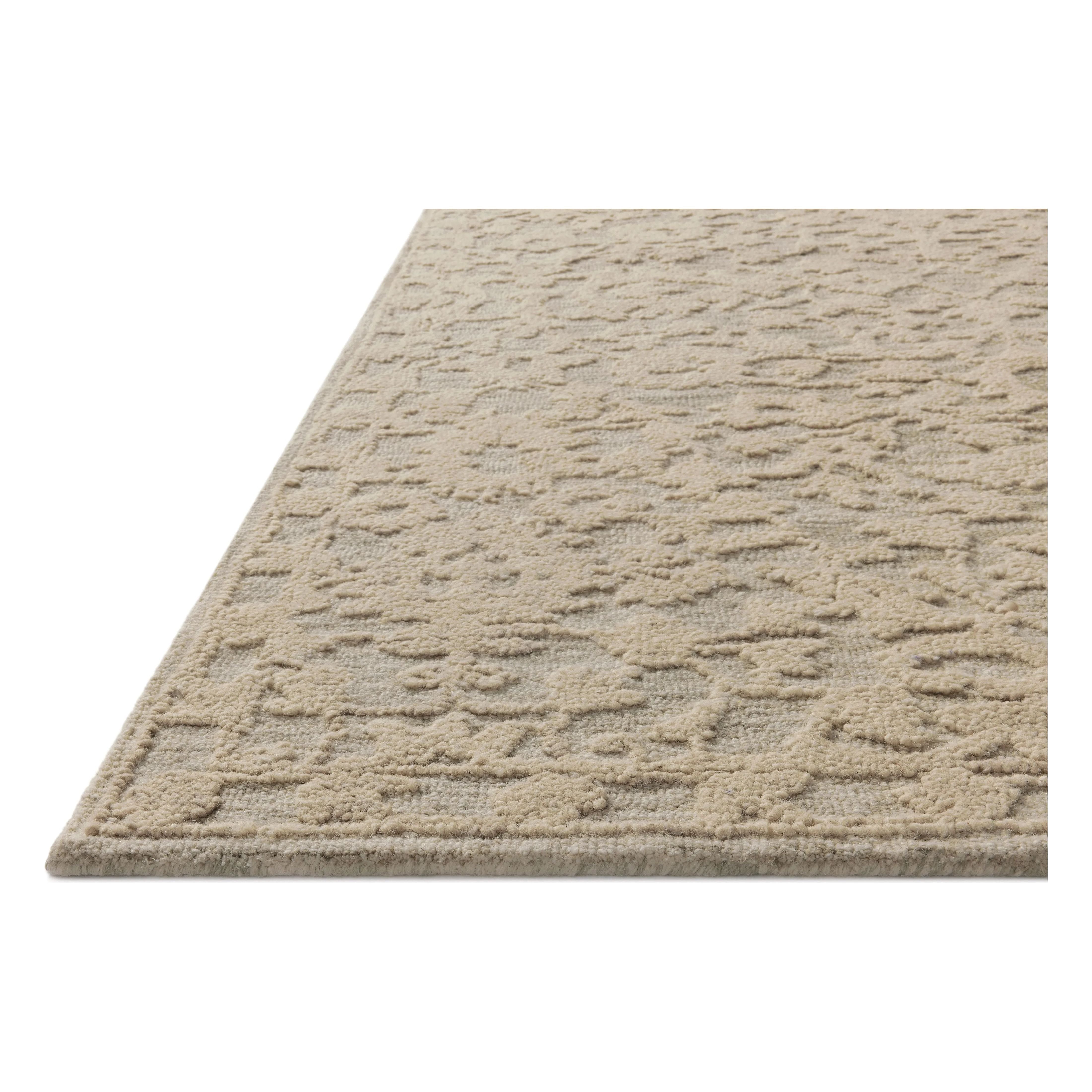 The Prudence Collection is a hand-tufted area rug made of soft, space-dyed wool and cotton, which lends a subtle gradation of color throughout the floral design. The rugs background is low-looped, while the pattern is made with a chunky, higher loop to create even more depth in this sophisticated design. Amethyst Home provides interior design, new home construction design consulting, vintage area rugs, and lighting in the Alpharetta metro area.