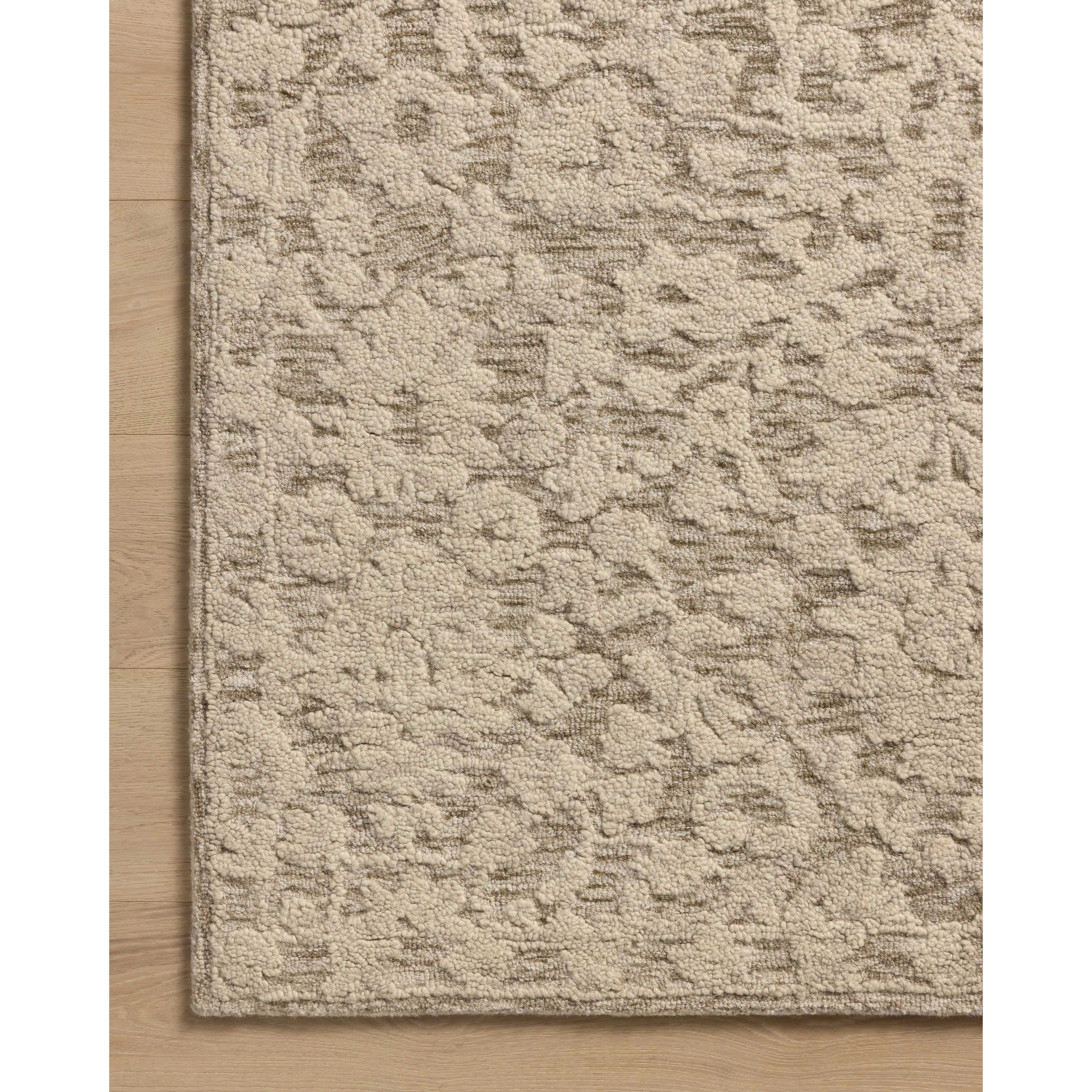 The Prudence Collection is a hand-tufted area rug made of soft, space-dyed wool and cotton, which lends a subtle gradation of color throughout the floral design. The rugs background is low-looped, while the pattern is made with a chunky, higher loop to create even more depth in this sophisticated design. Amethyst Home provides interior design, new home construction design consulting, vintage area rugs, and lighting in the Omaha metro area.