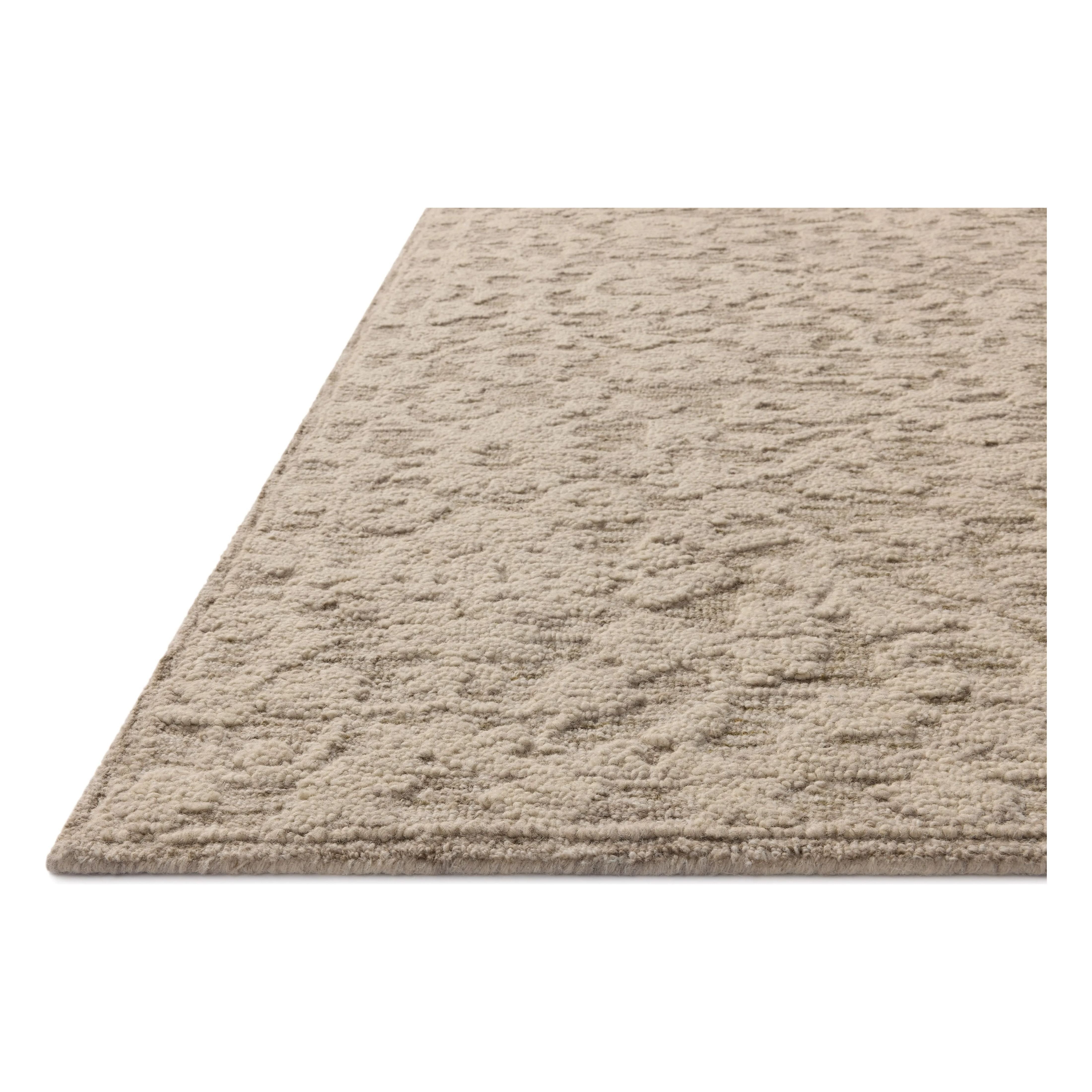 The Prudence Collection is a hand-tufted area rug made of soft, space-dyed wool and cotton, which lends a subtle gradation of color throughout the floral design. The rugs background is low-looped, while the pattern is made with a chunky, higher loop to create even more depth in this sophisticated design. Amethyst Home provides interior design, new home construction design consulting, vintage area rugs, and lighting in the Tampa metro area.