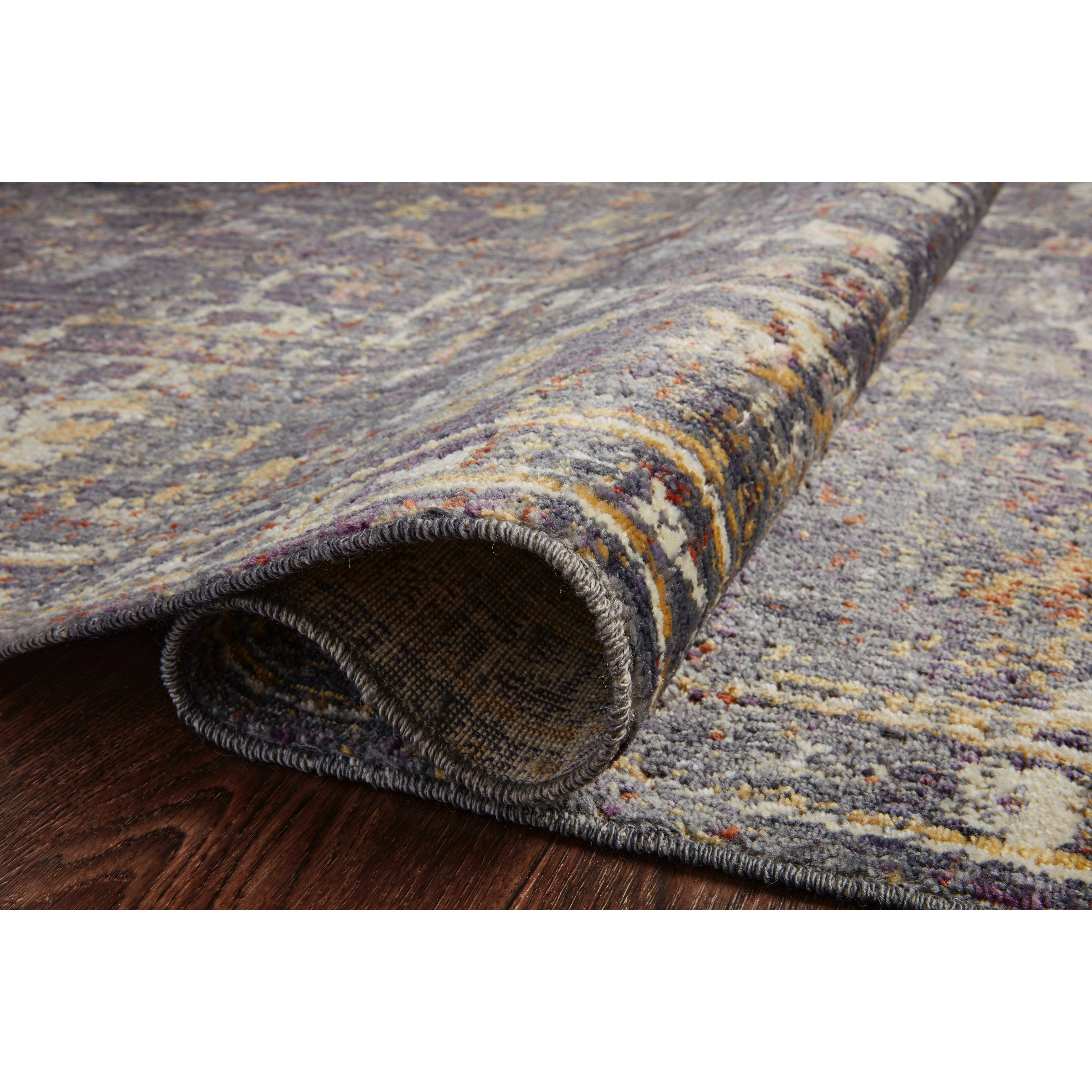 Durable, low pile, and soft, this rug is inspired by classic vintage and antique rugs. The Rosemarie Chris Loves Julia Graphite / Multi ROE-04 rug from Loloi features a beautiful vintage pattern and patina. The rug is easy to clean, never sheds, and perfect for living rooms, dining rooms, hallways, and kitchens!